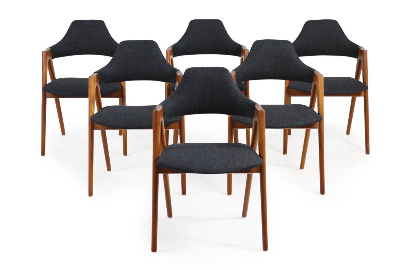 Beautiful set of six Kai Kristiansen 'Compass' dining chairs, solid teak wood, new upholstery and covered with new dark grey wool fabric, best condition, 1960s made in Denmark, Danish modern design.
    