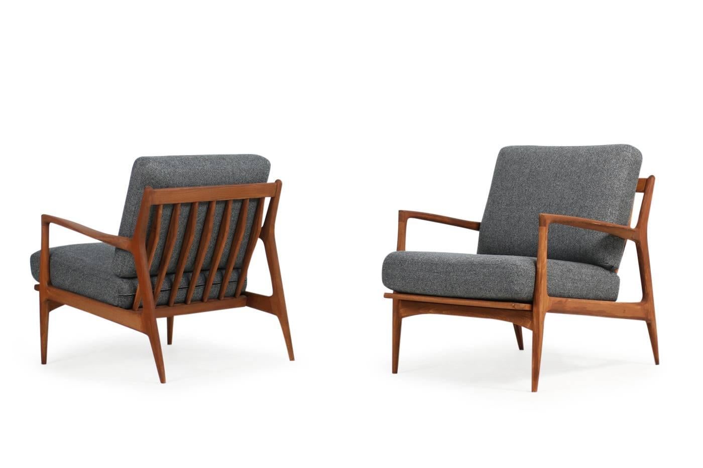 Beautiful set of two matching, organic, 1960s easy chairs, designed by Ib Kofod Larsen, beechwood, teak stained, new upholstery and new high quality, grey wool woven fabric. Fantastic condition, beautiful form and design.