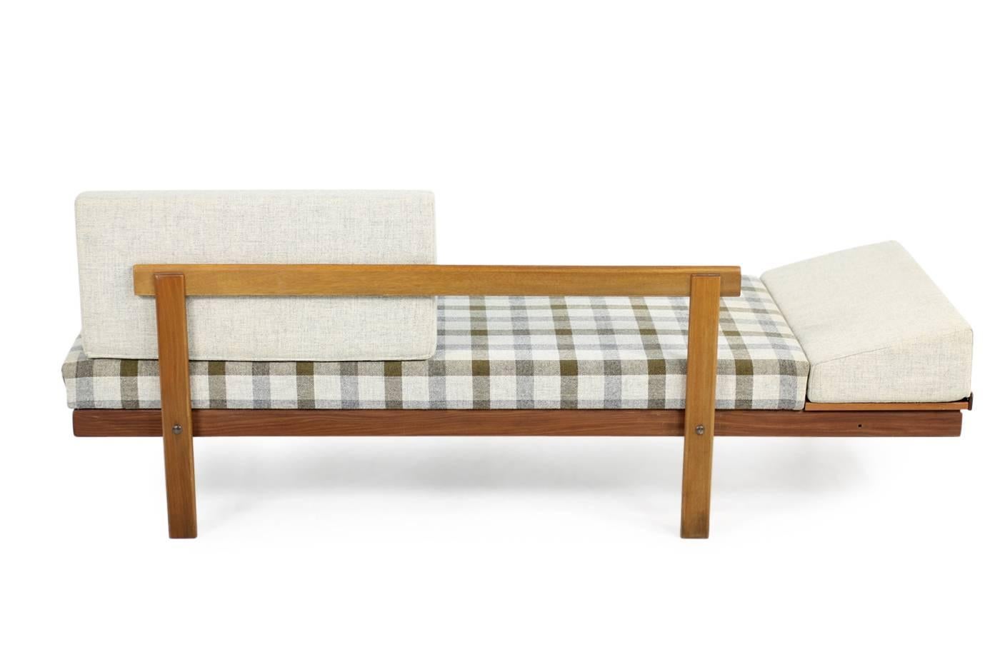 Beautiful Norwegian Mid-Century Modern daybed from the 1950s in fantastic authentic condition. Teak & Beech base in great condition, also possible using it as a daybed. Cool storage unit under the side table.

Sofa dimensions: W x D x H 192 x 75 x