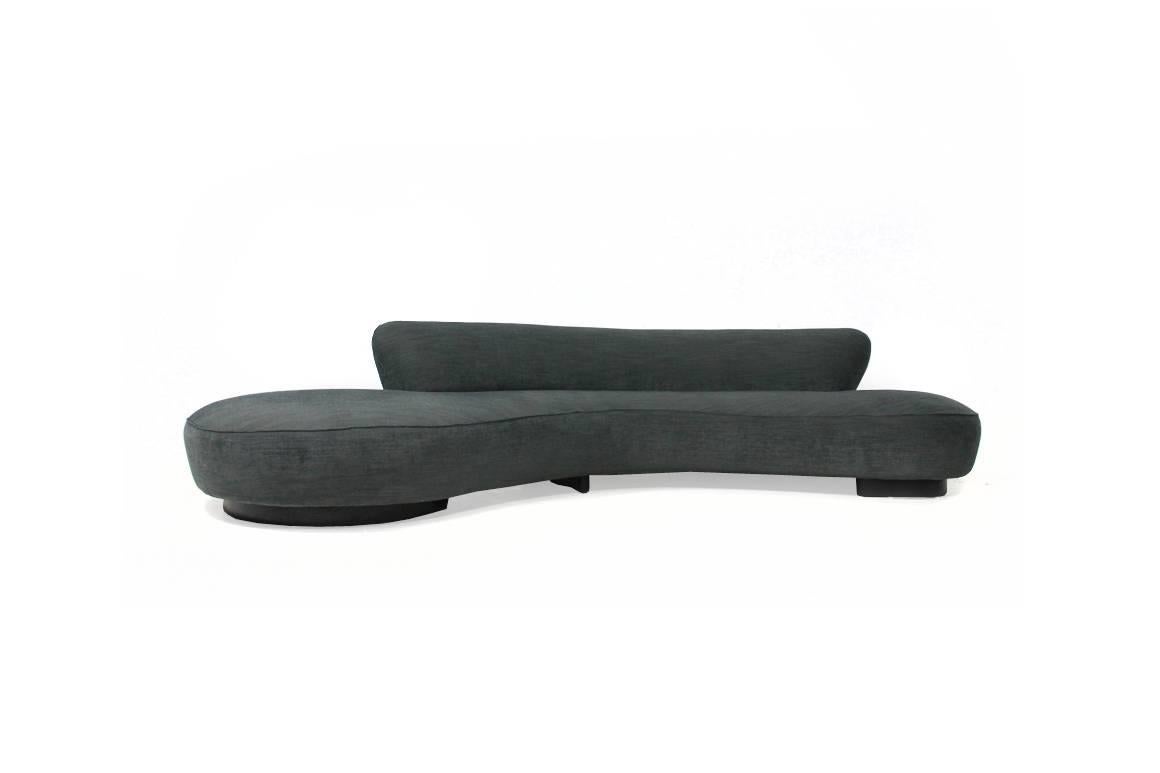 Very large serpentine sofa and the a rare ottoman by Vladimir Kagan for Directional. The set is in a very good condition, was covered in 2014 with high quality woven fabric, of course free standing, upholstery in best condition. The legs were