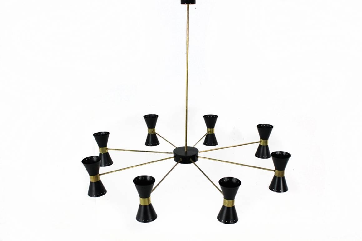 Beautiful and rare Italian metal chandelier in Stilnovo Style, 8 arms, for 16 bulbs E14, beautiful patina on the brass parts, the chandelier has beed rewired, overall a very good vintage condition, 2 pcs. available. 