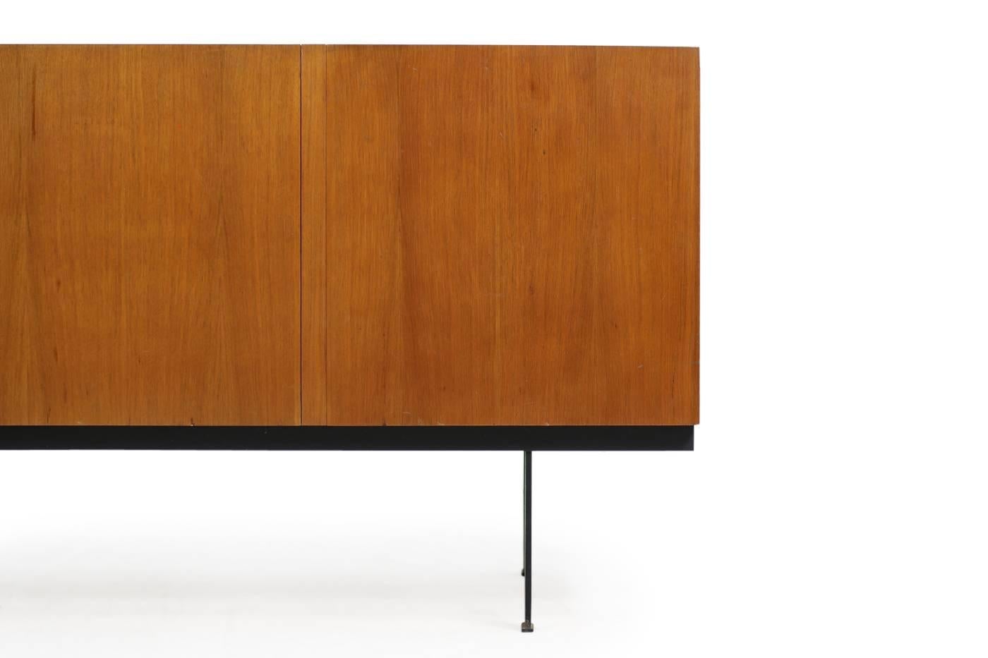 Beautiful 1960s vintage Minimalist sideboard, removable and adjustable shelves inside, great authentic condition, unknown Designer, probably made to order or an unique item, could be from Behr Moebel or a small edition. Beautiful teak outside and