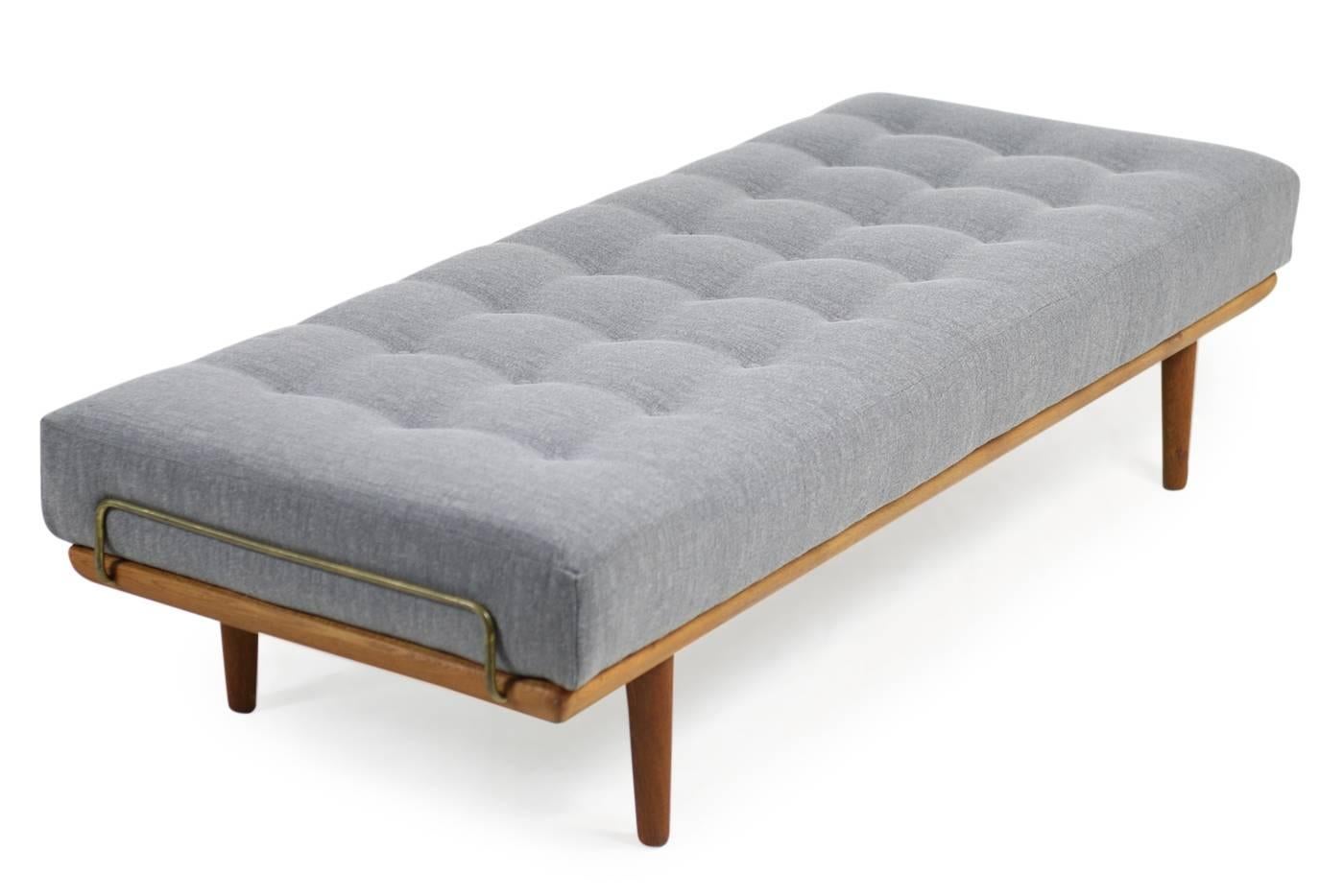 Amazing 1950s Hans J. Wegner daybed, model GE19 for GETAMA, Denmark. Very good condition, the original innerspring mattress was reupholstered and covered with new, high quality woven fabric in grey. The teak wood frame is in a fantastic condition.