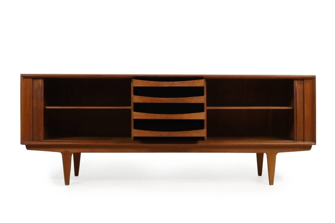 Beautiful 1960s Danish modern design by Bernhard Pedersen & Son (BPS) sideboard made of Teak Wood.
Beautiful condition, also very clean from the inside. Tambour doors work perfect, drawers and shelves inside.