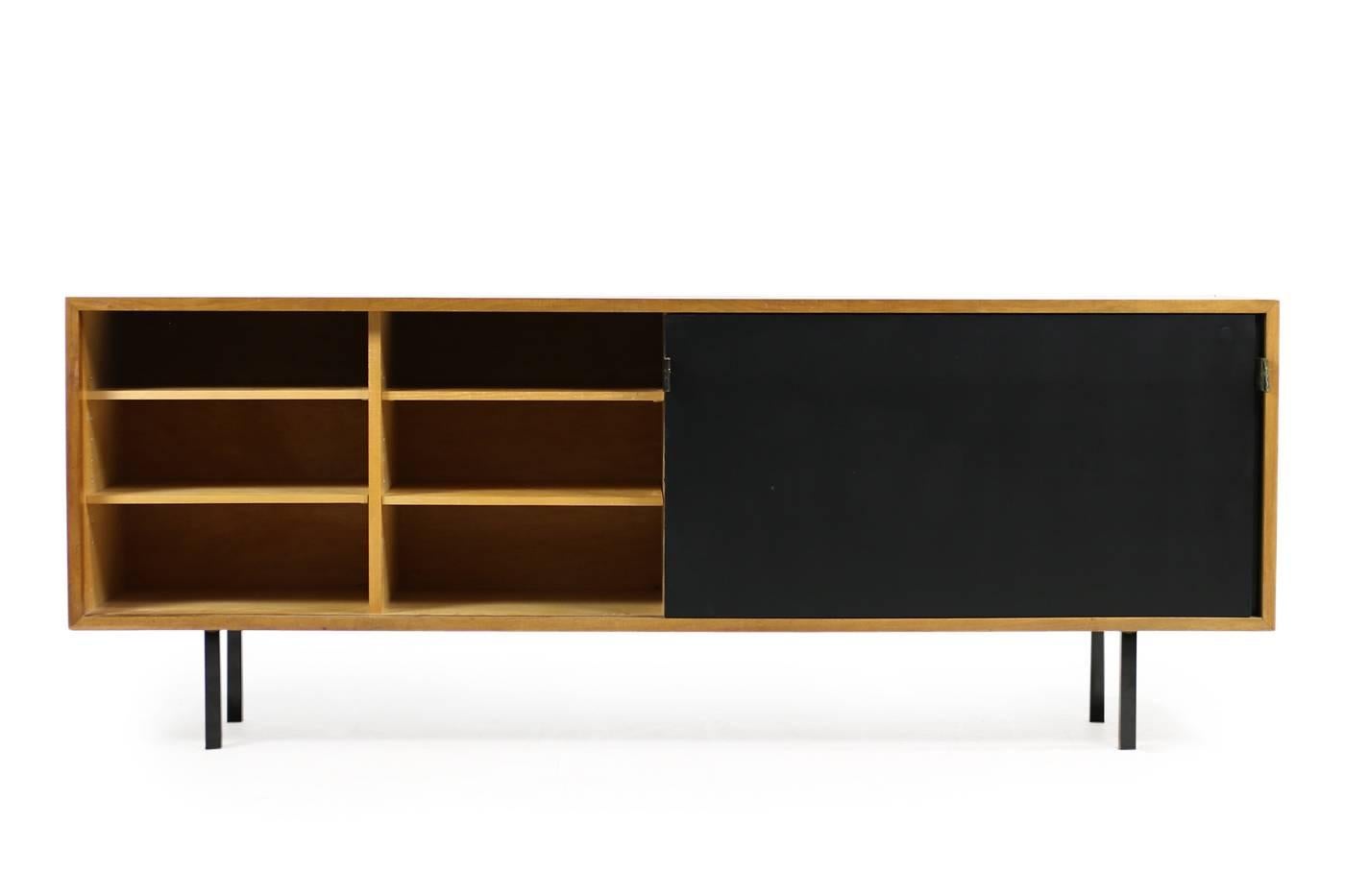 Beautiful, Florence Knoll sideboard model 116 for Knoll International, manufactured for Knoll for Wohnbedarf S.A Switzerland in the 1950s.
Fantastic condition, adjustable shelves inside, cherrywood and maplewood. Metal legs, leather handles with