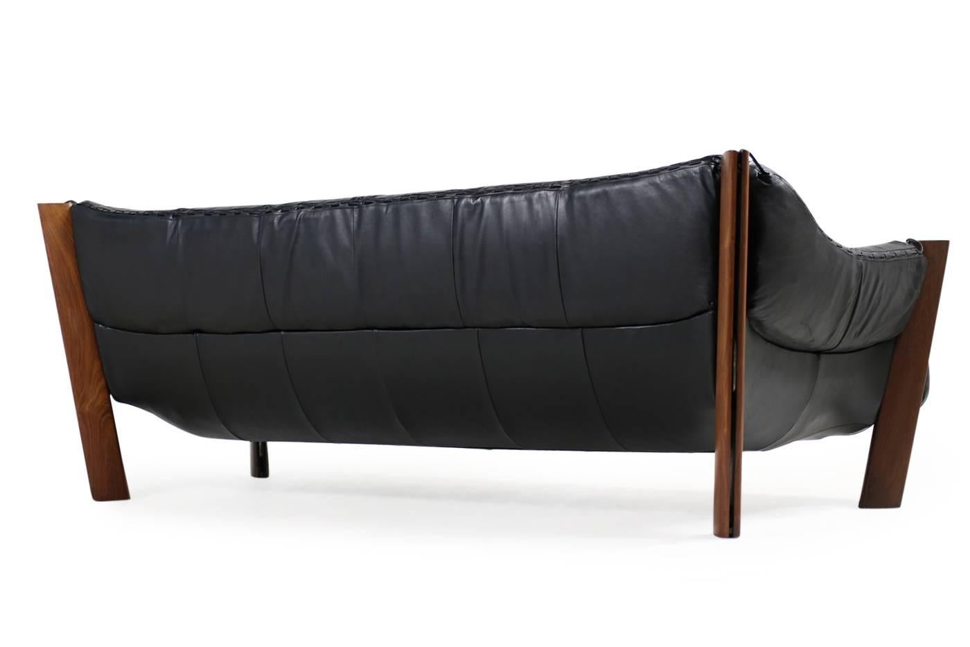Beautiful vintage sofa by Percival Lafer, designed in 1974 in Brazil, solid wooden jacaranda base and leather. 

Measures: sofa 220 x 93 x 74cm SH 38cm
Chairs 95 x 93 x 74cm SH 38cm
Ottoman 80 x 60 x 38cm.
 