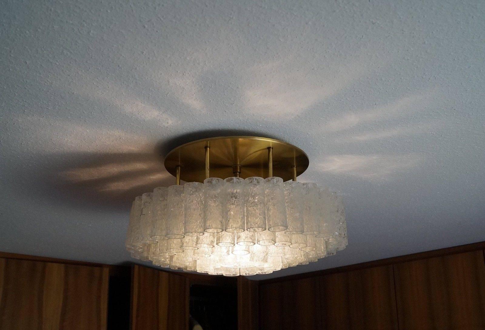 Beautiful 1960s chandelier, flush mount, almost 100 glass tubes, very good condition with spare glass tubes. For one Edison bulb, up to 100W (two pieces. included) Solid brass fixture.
 
