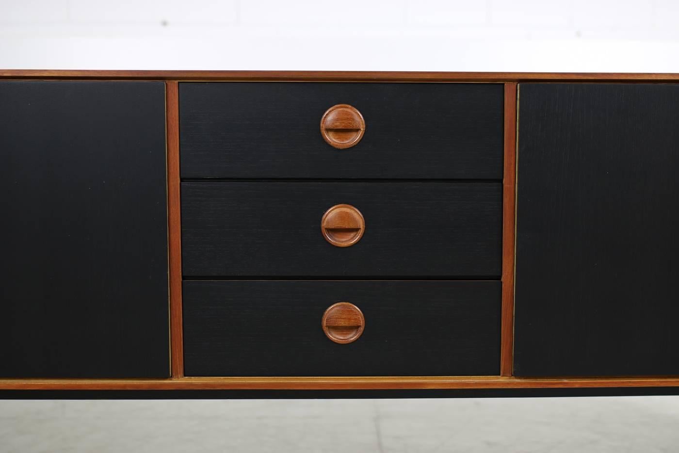 Dutch Large 1960s Teak & Black Sideboard by Fristho with Iron Base and Brass Details For Sale