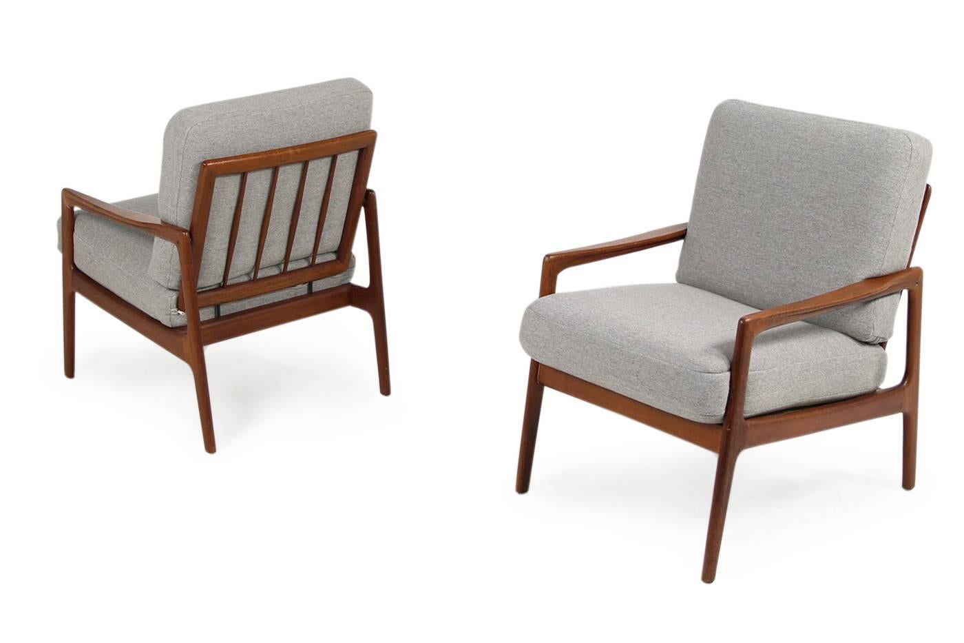 Beautiful pair of 1960s, Danish modern easy chairs, beautiful vintage lounge chairs, teak frames, new upholstery and covered with new high quality wool woven fabric, fantastic condition, early edition, manufactured prob. by Komfort Mobler, Denmark.