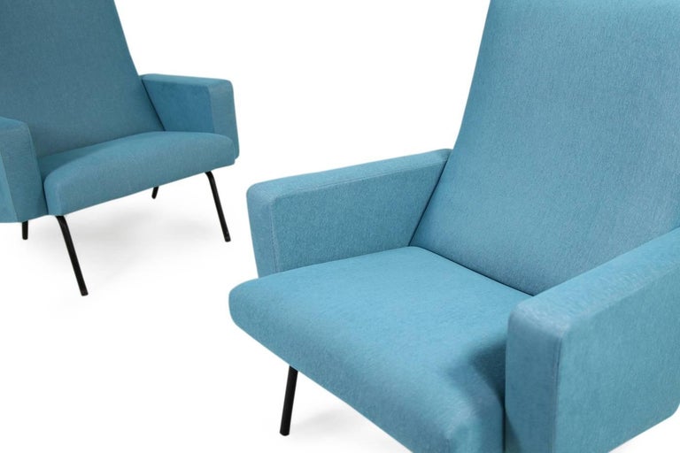 Beautiful and super rare French 1950s lounge chairs, restored upholstery and covered in a high quality linen/cotton fabric. Best condition, beautiful turquoise soft fabric, round metal legs, super comfortable and very rare. Highback armchairs, solid