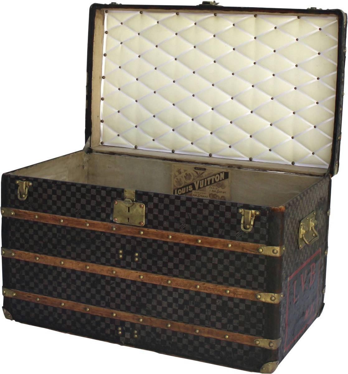 Finished in the iconic Damier pattern from Louis Vuitton this incredible trunk would make a perfectly sized coffee table. 

The leather edging has a beautiful patina and is adorned with brass hardware.
