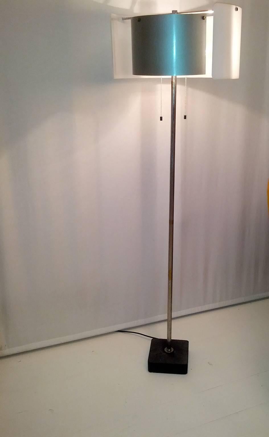 Wonderful rare floor lamp designed by Gino Sarfatti and manufactured by Arteluce during the 1950s. Mod.n.1056.
Made of methacrylate, aluminium, chrome-plated brass, cast iron.
This example is in good original condition with oxidations on the