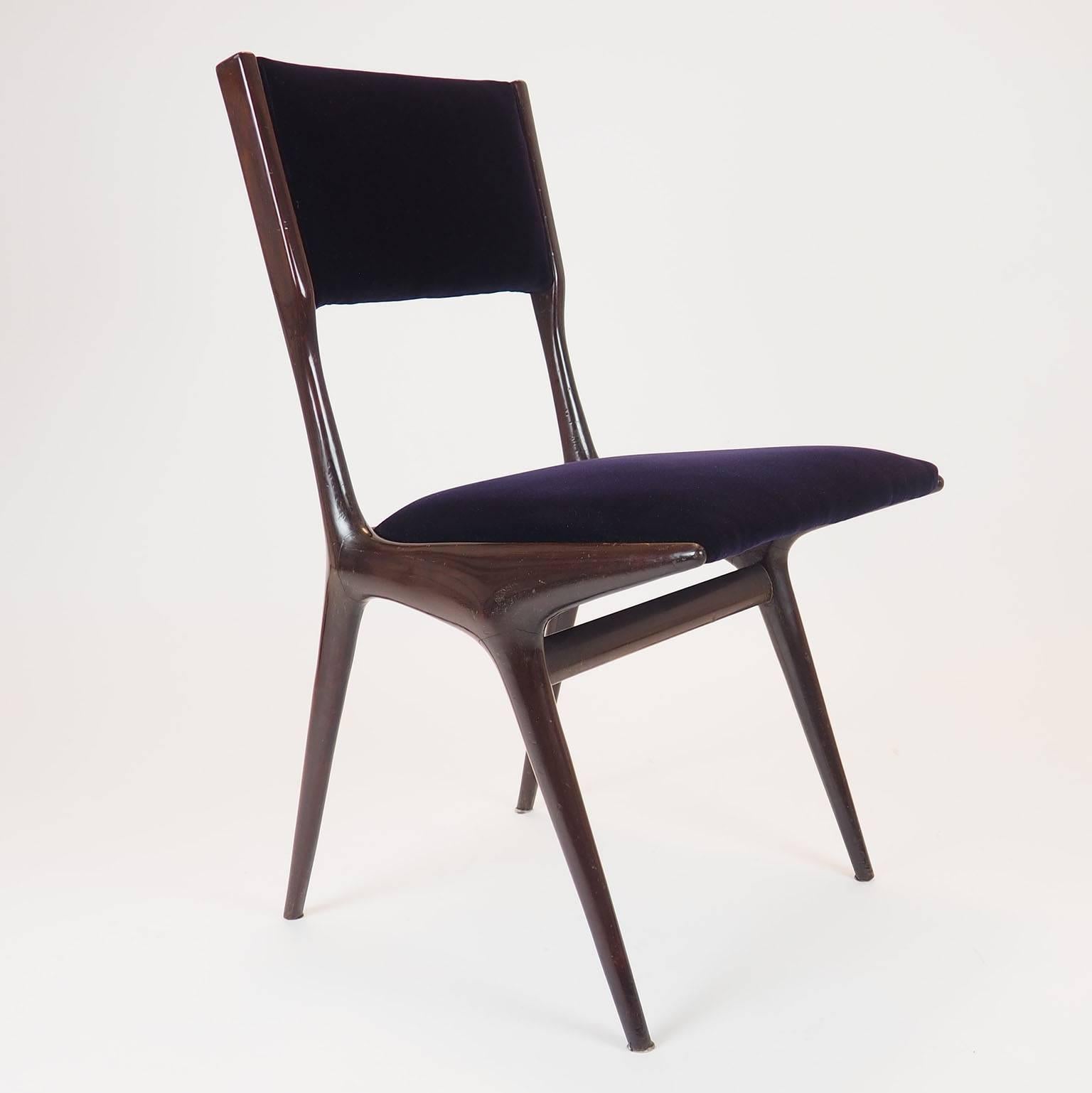 Splendid chair designed and presented for the first time at the Milano IX Triennale in 1951 by Carlo de Carli with Cassina.
One of the most beautiful Italian chairs from 1950s.
Aubergine velvet on the seat. Structure in mahogany.
Published: Il