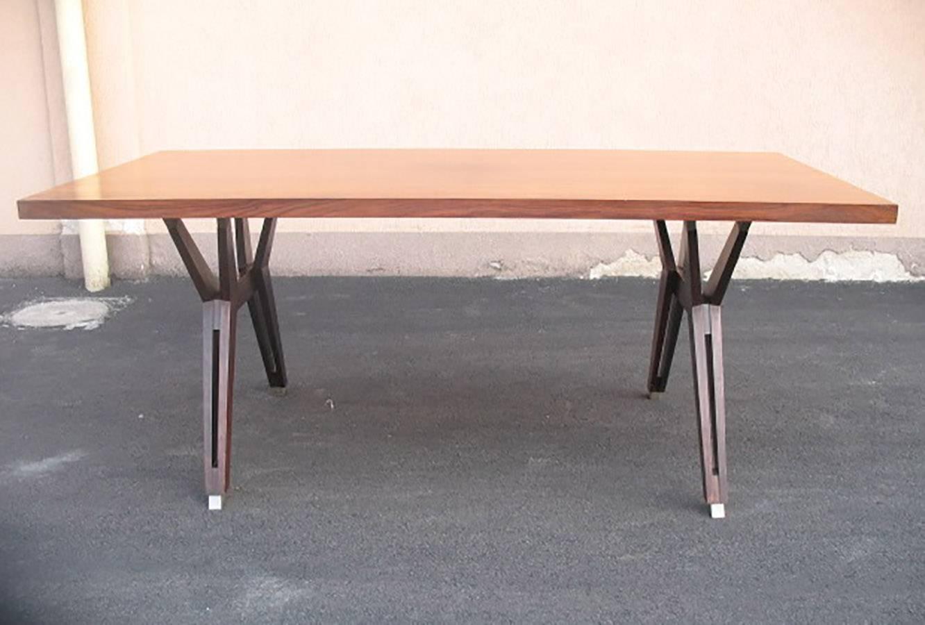 Beautiful table; iconic techinical design by Ico Parisi for MIM (Mobili Italiani Moderni) in Roma.
Rosewood rectangular top on wood legs with final brushed steel sabot.