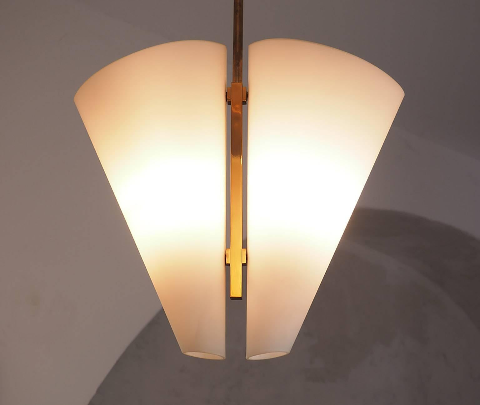 Rare chandelier Mod. 1930 designed by Fontana Arte in Milano during the second half of the 1950s. 
Rare, timeless  and essential elegance from 1950s and 60s  Fontana Arte production.
Two satin white glass conical shades are backed by an elegant