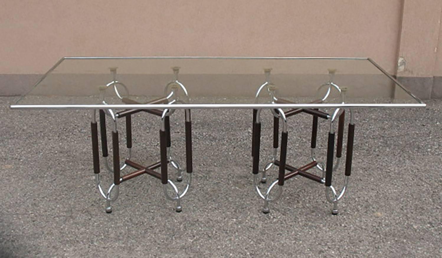 Table Tri-5, from the serie Trilogia designed by Gabetti e Isola for a little production manufactured by ARBO in Torino. 
Two chrome-plated tubular structure in steel and rosewood with rectangular glass top refine in chrome.
Publ: Gabetti e Isola