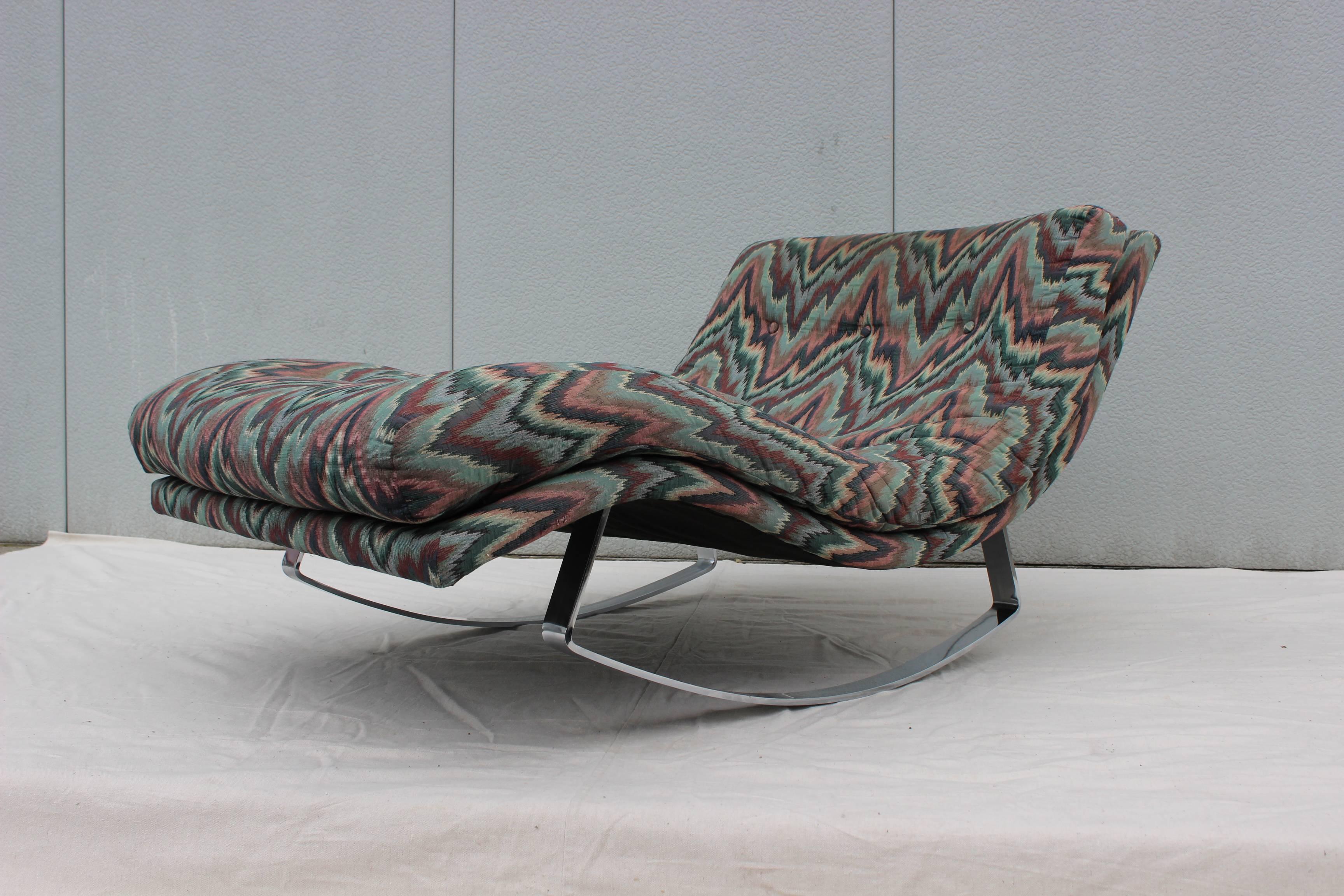 1970's steel base with chrome finish rocking chaise longue, in vintage upholstery. 