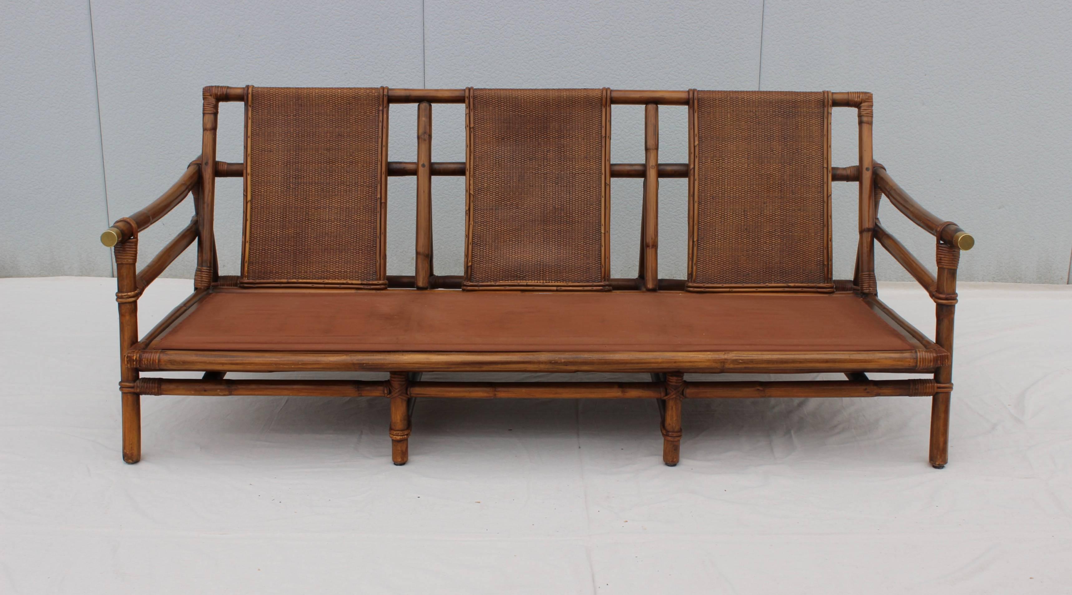 Stunning 1950s John Wisner designed for Ficks Reed rattan sofa.