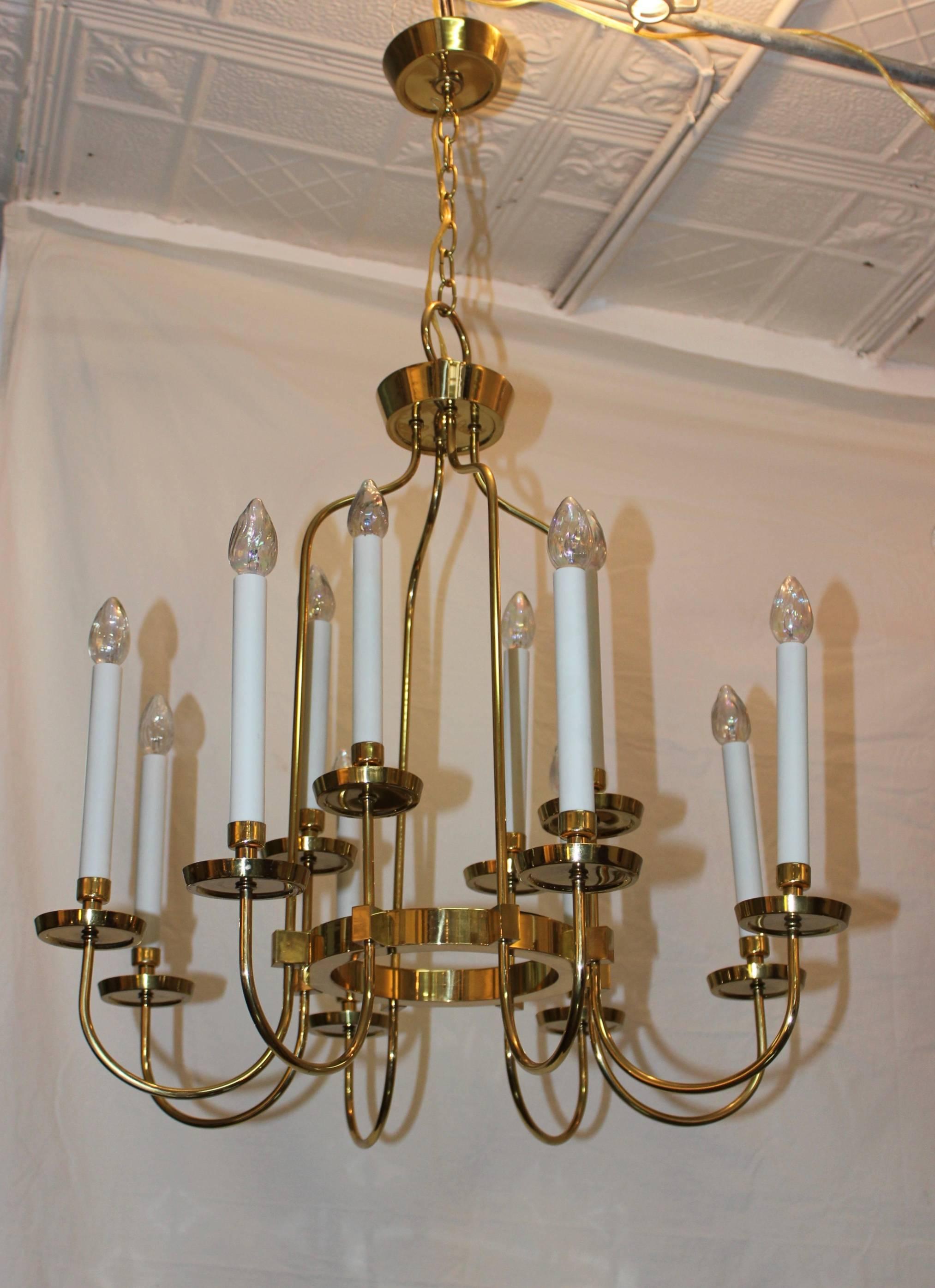 1960s modern twelve-arm brass chandelier in the style of Tommi Parzinger.