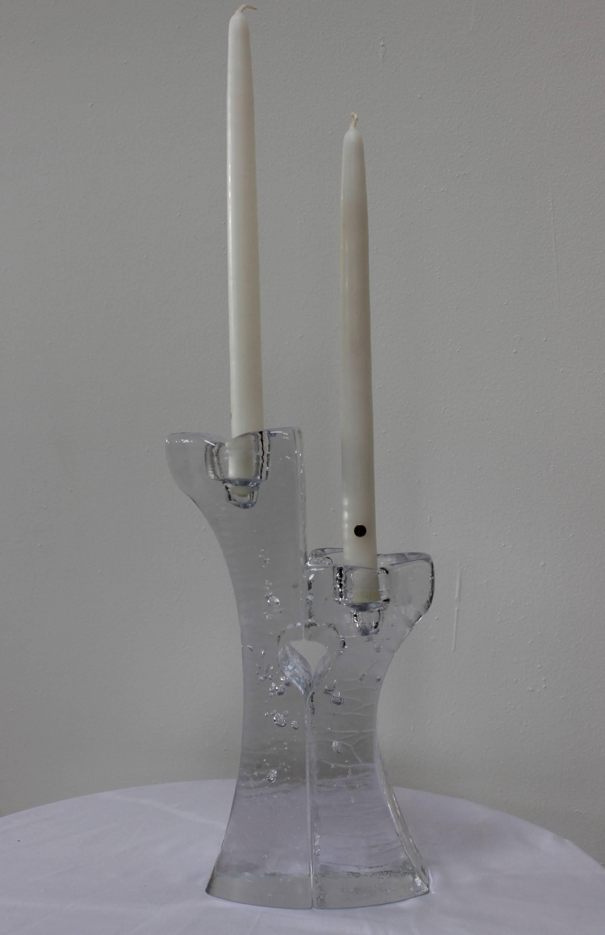 1970s modern glass candle holders by Kosta Boda.

Small candle holder width 3'' depth 3.5'' height 8.5''.