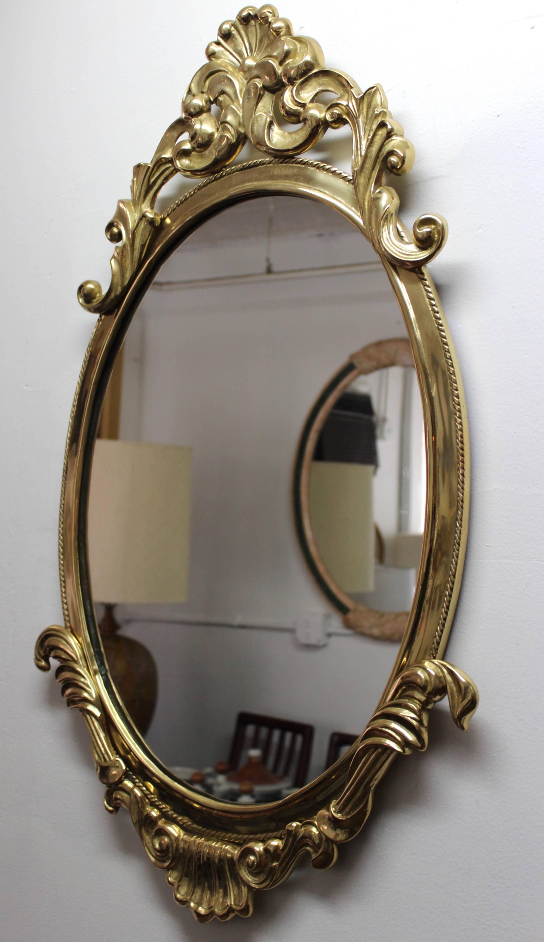 Stunning 1970s French style well made and heavy brass oval mirror.