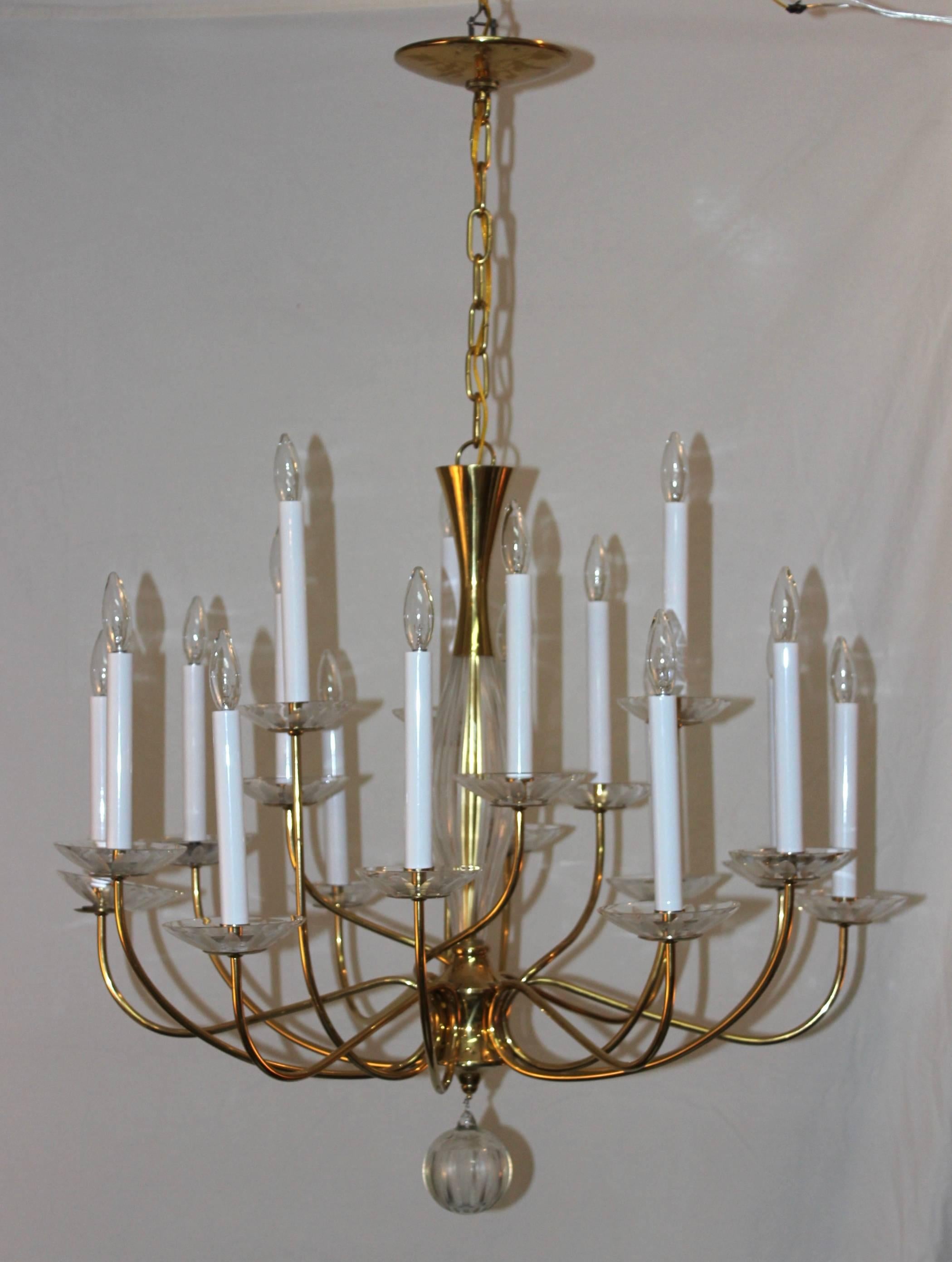 1950s modern large brass and cut glass 18-arm chandelier by Lightolier.

The height can be adjusted. 

