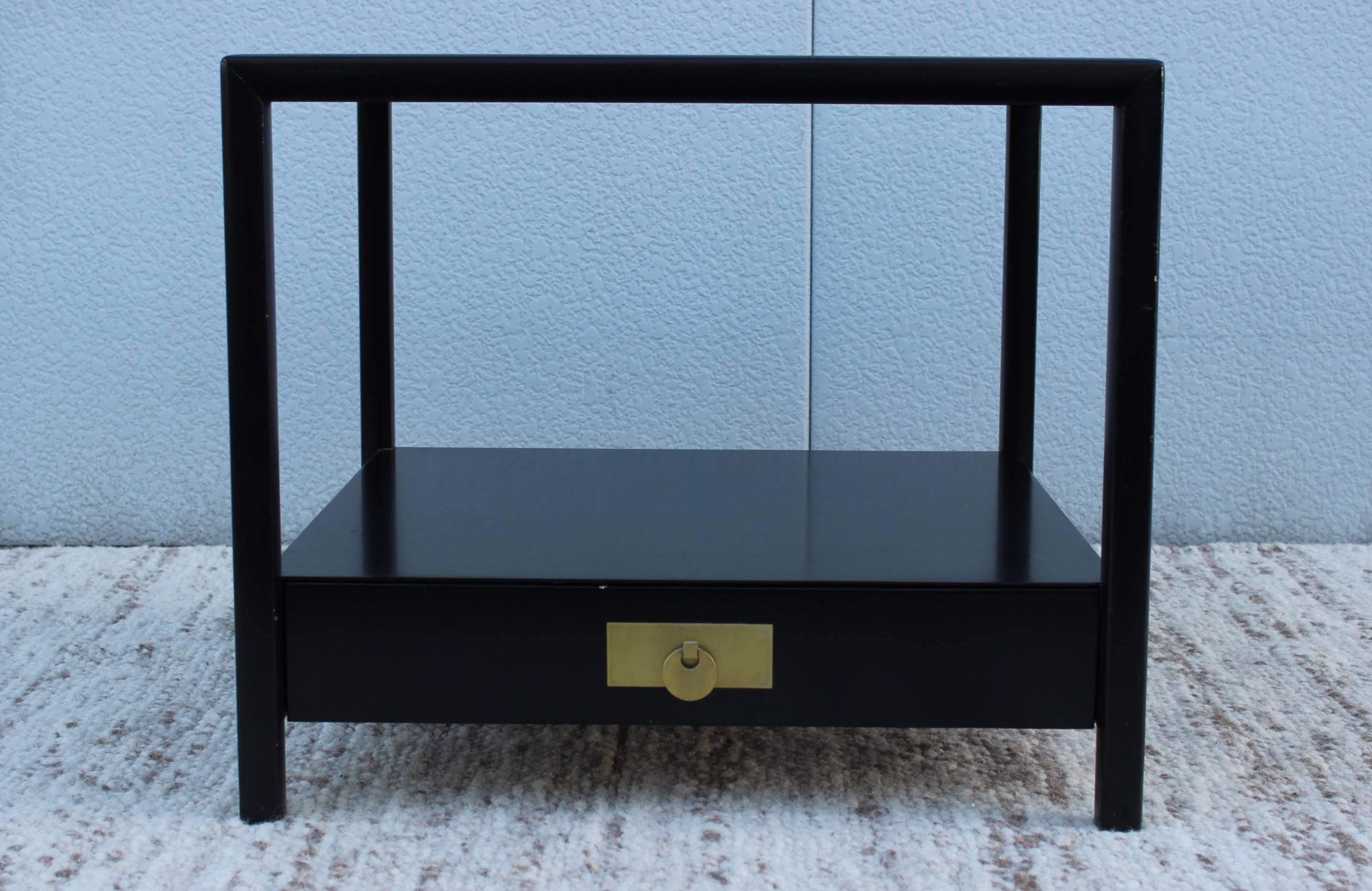 1960s Michael Taylor design from the "New World collection" for Baker, lacquered side table with brass hardware.