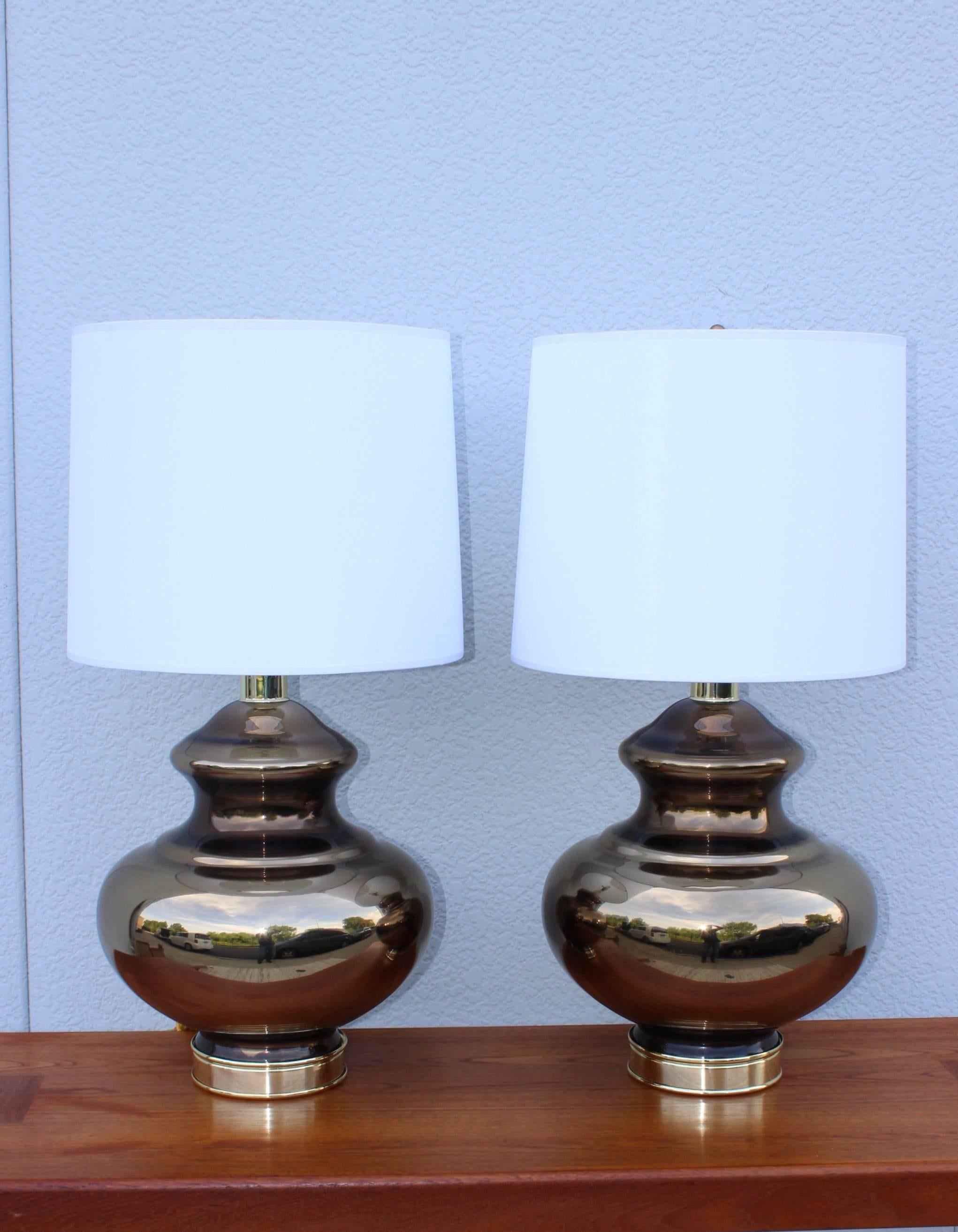 Stunning pair of large 1960s mercury glass table lamps with brass hardware, newly rewired. 

Height to light socket 21''.

Shades for photography only.