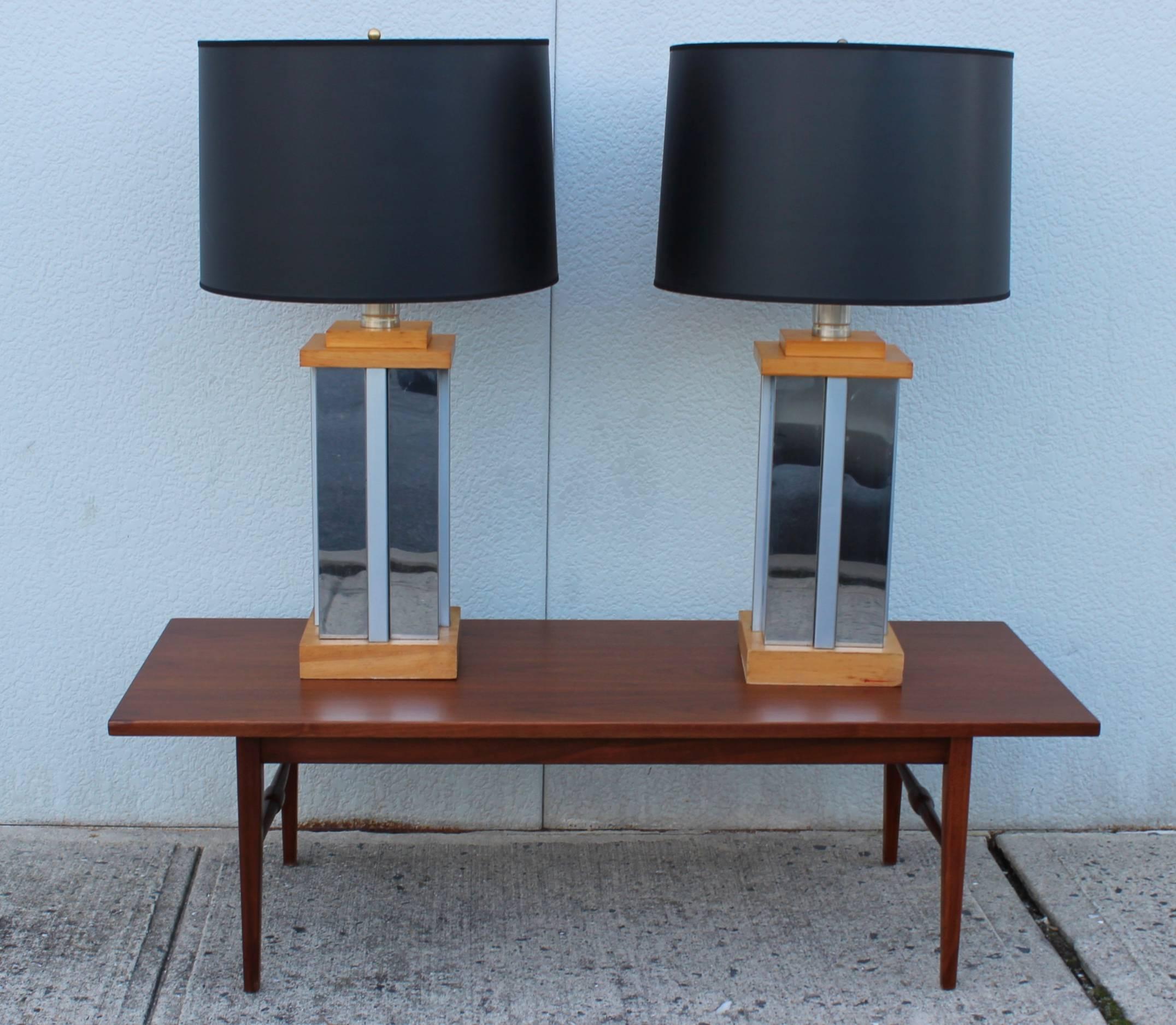 Large pair of 1970s chrome and wood table lamps, in the style of Curtis Jere.

Shades for photography only.

Measures: Height to light socket 24''.