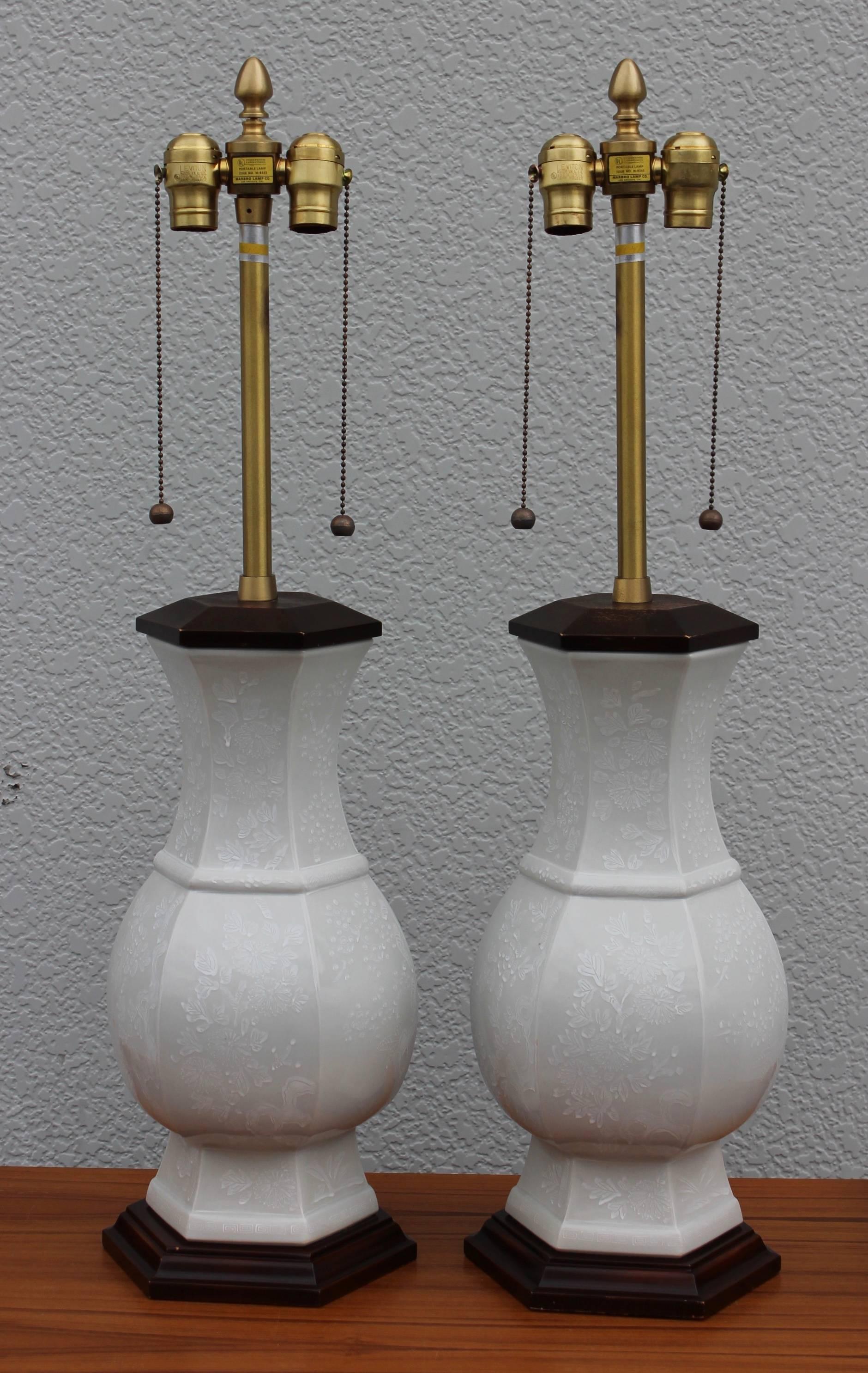 Stunning pair of 1960s Blanc de Chine ceramic table lamps with brass hardware by Marbro Lamp Company.

Shades for photography only.