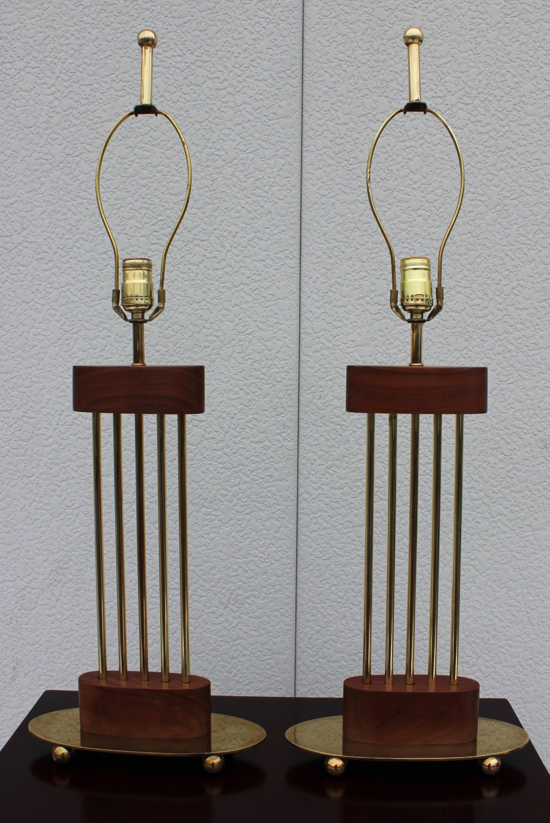 1960s, modern brass and walnut Italian table lamps.

Shades for photography only.

Height to light socket 21.5''.