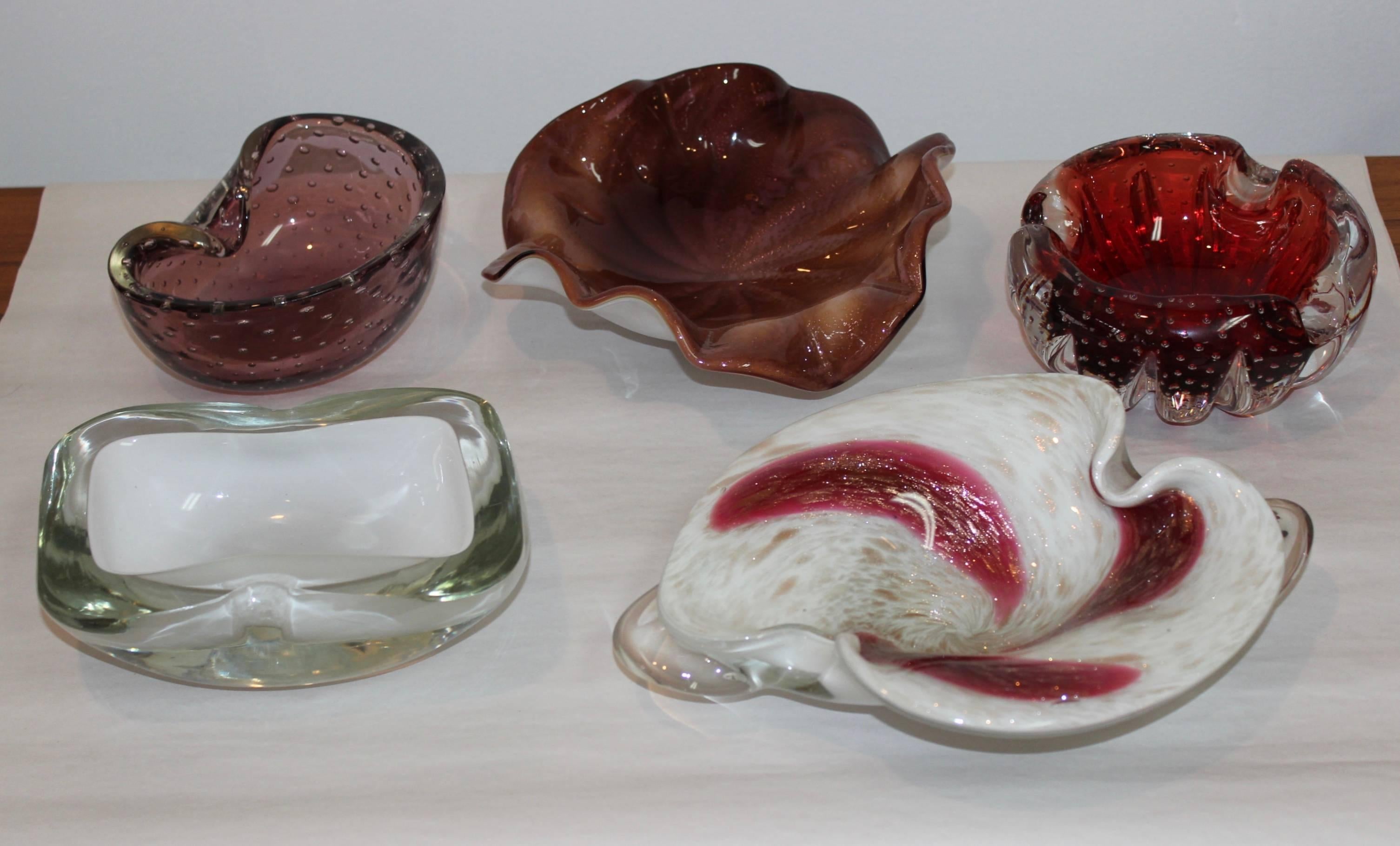 Mid-Century Modern Murano glass decorative glass bowls collection.

Price is per item please check the ones available below.

Dimensions:

Red bowl diameter 6'' height 2 25'' Sold
White and clear width 7'' depth 5'' height 2.25''
light purple width