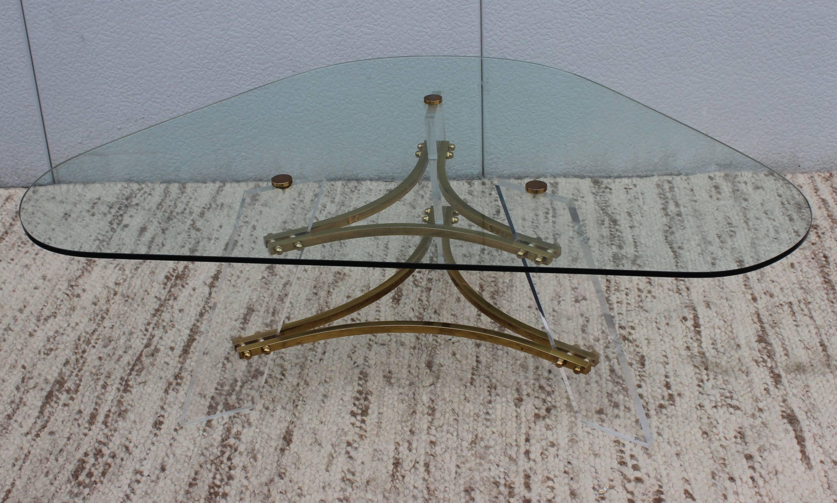 1960s Charles Hollis Jones brass and Lucite coffee table with glass top.

Matching pair of side tables is also available.