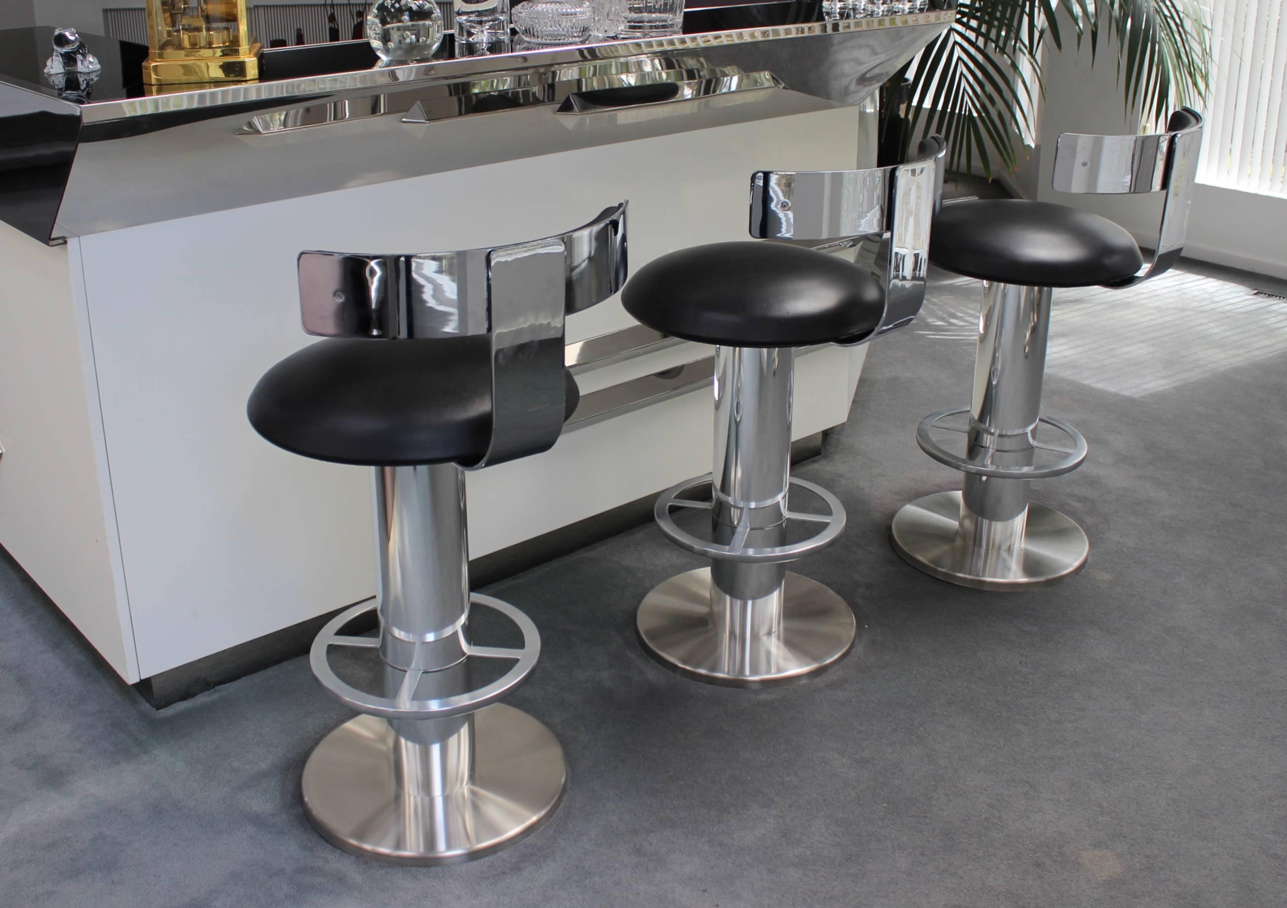 Stunning set of three 1980s designs for Leisure swivel bar stools. With chrome nickel-plated and steel and leather upholstery.
