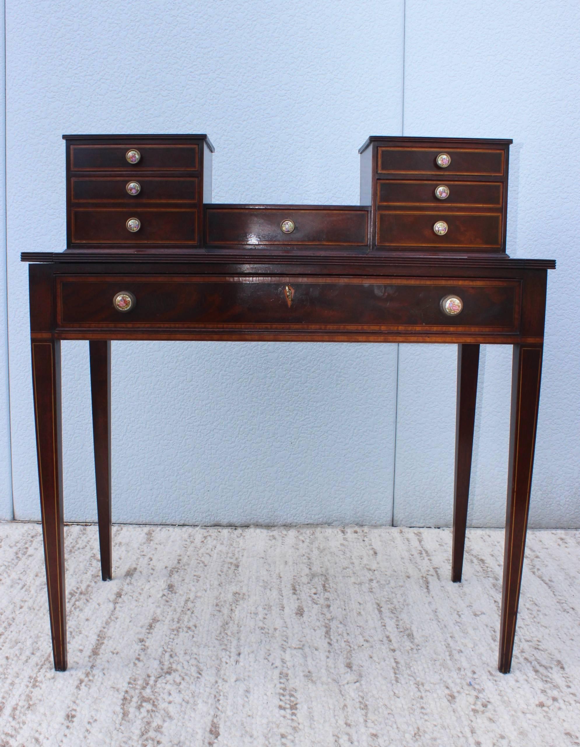 1940s, French inlay desk with pull-out tray and drawers. With original brass and ceramic handles and original key. 

Second height 38''.