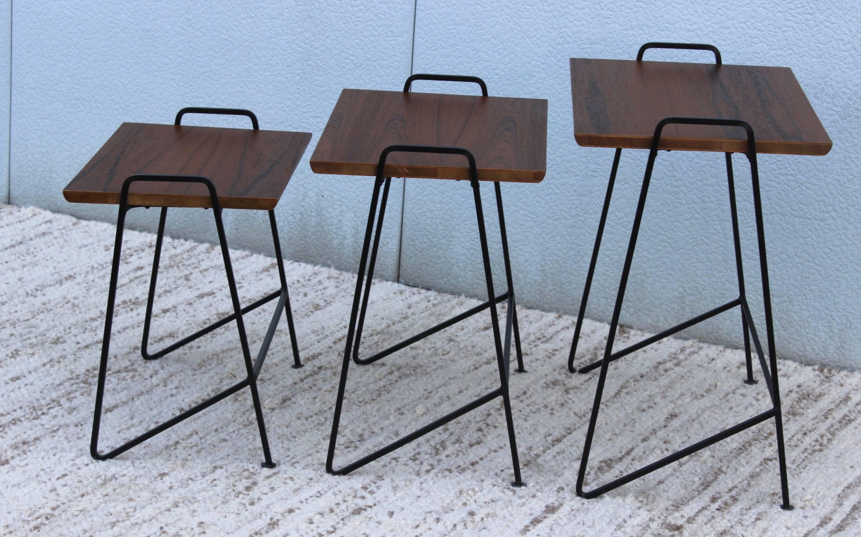 Stunning set of 1950s Tony Paul modernist nesting tables, newly refinished with teak top.