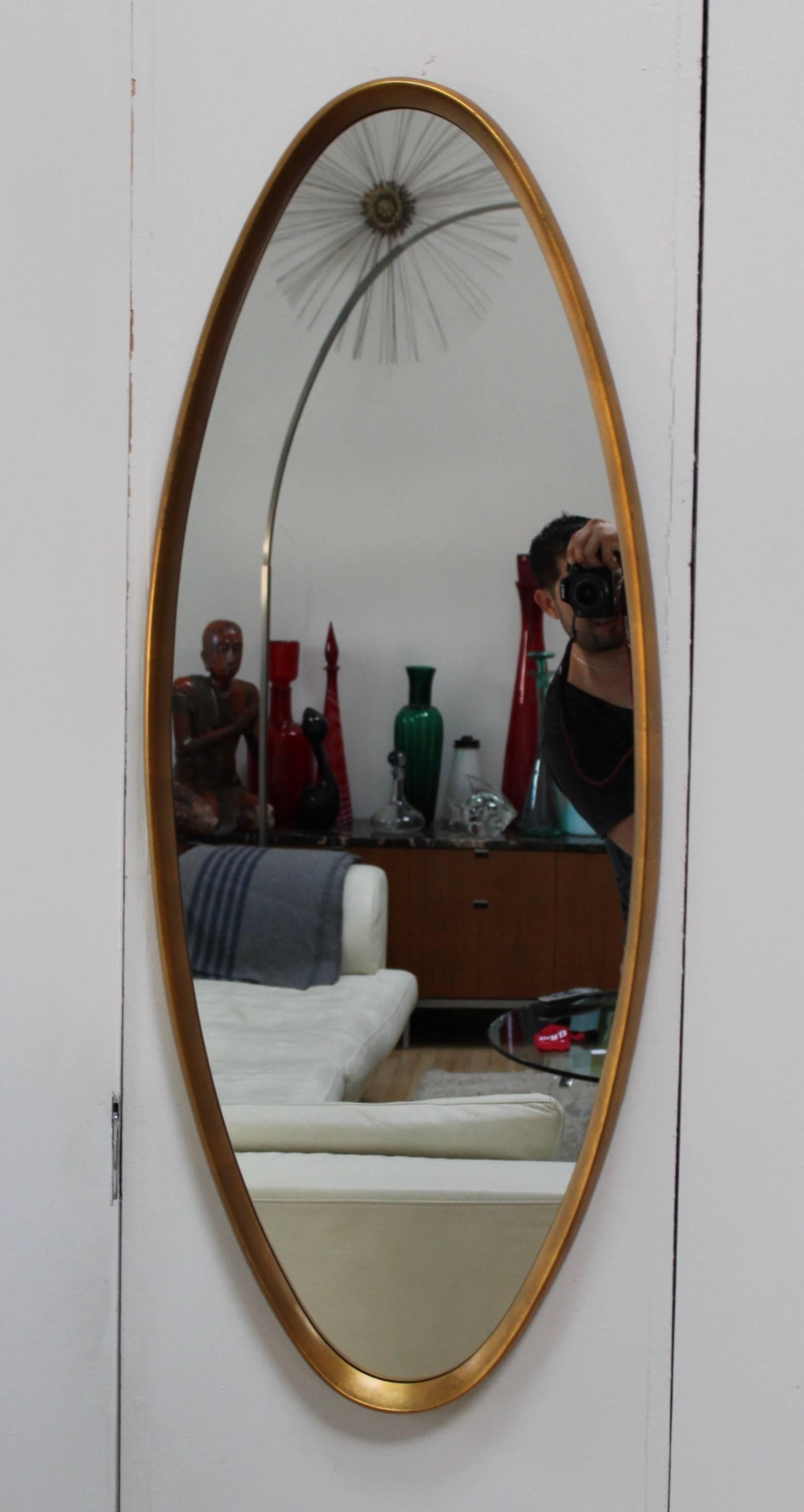 Stunning, 1950s La Barge style gold leaf modern oval mirror.

Two available price is for each.