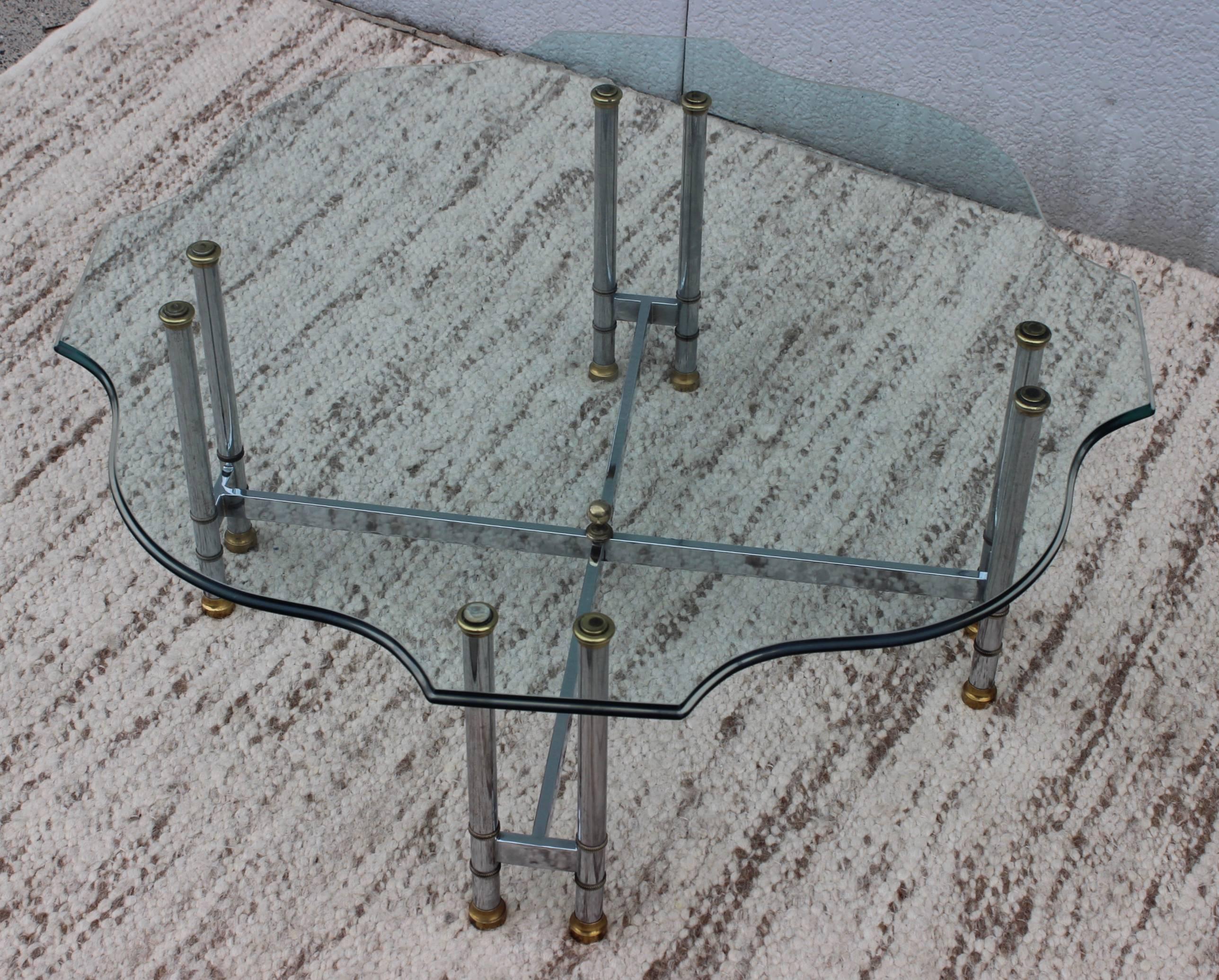 1960s Maison Jansen style coffee table, with brass and chrome base and beveled glass top.