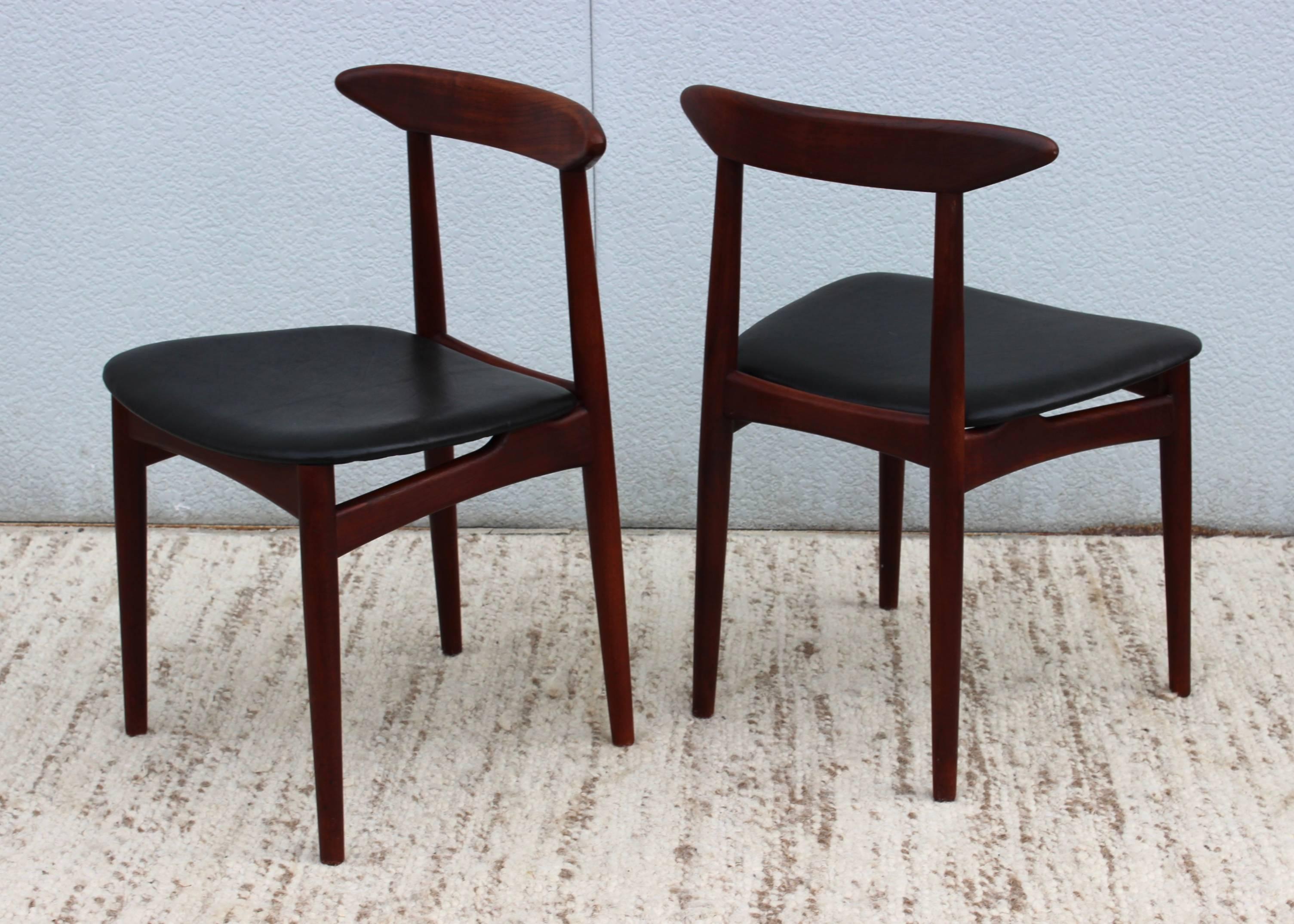 1950s Danish teak with leather upholstery side chairs.