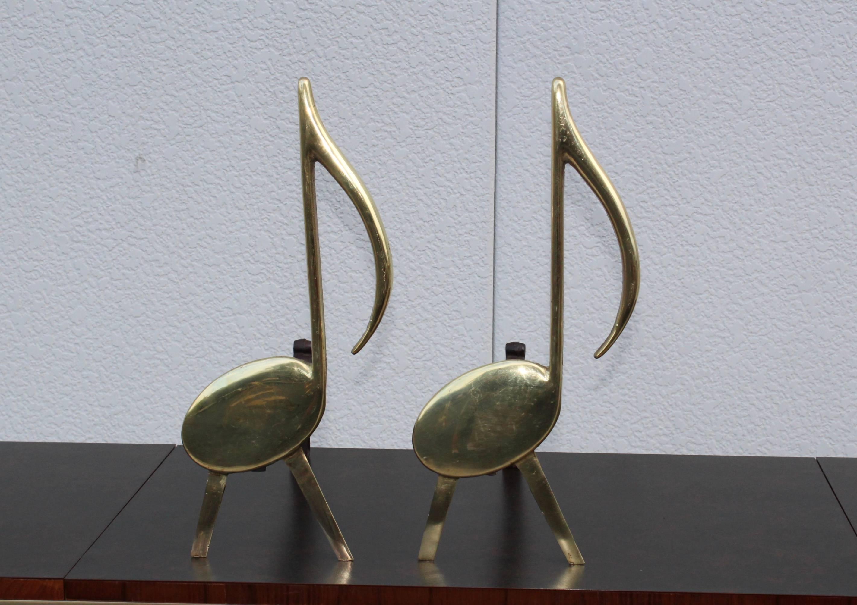 1940s music notes brass and cast iron andirons by Tenn. Chrome Plate Co. Nashville.