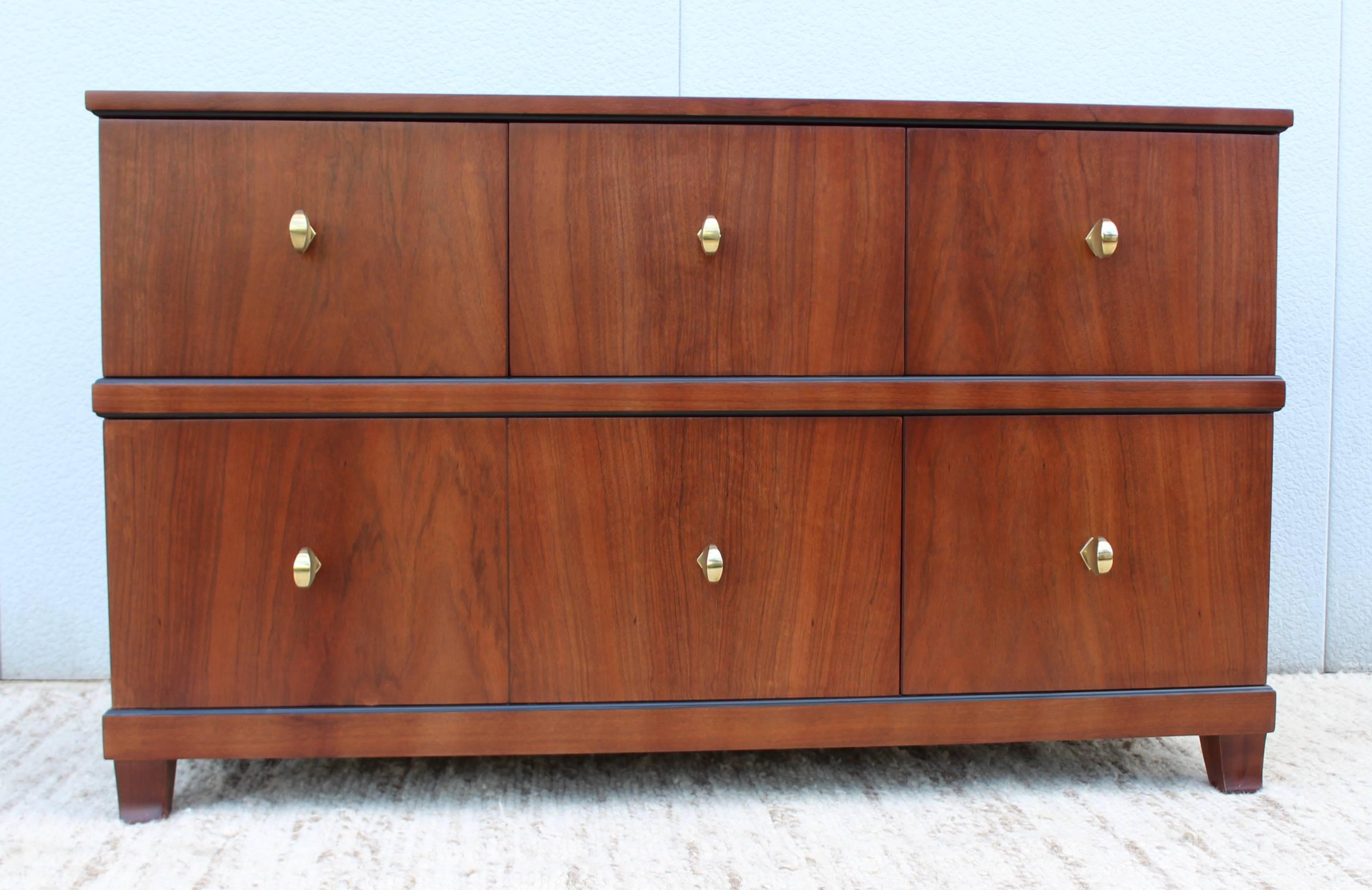 Rare 1940s custom order Paldao wood five-drawer dresser designed by Gilbert Rohde for Herman Miller. With brass hardware newly refinished.

Matching tall dresser is available.