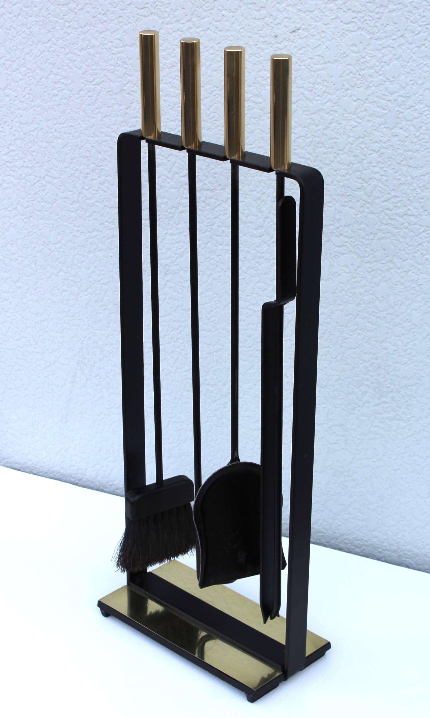 Stunning set of 1950s modernist brass and iron fireplace tools manufactured by Pilgrim.