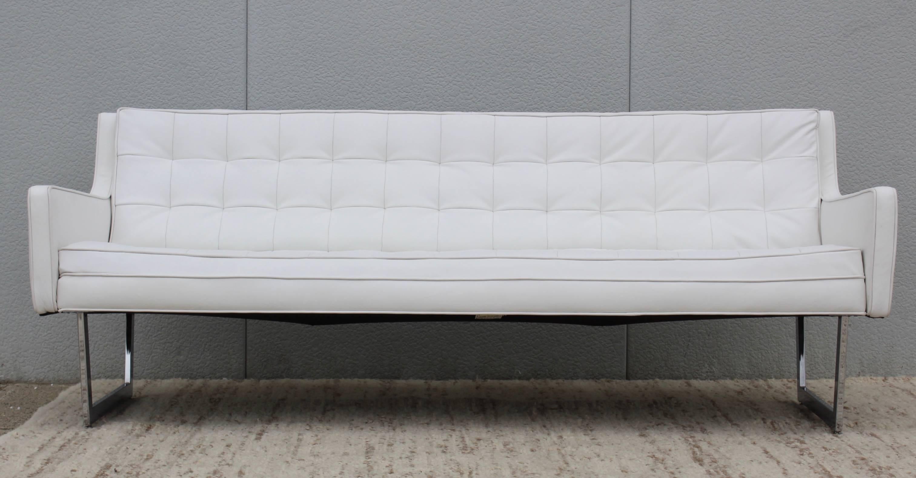 Stunning 1960s modern sofa by Patrician Furniture. Newly upholstered in white leather.
