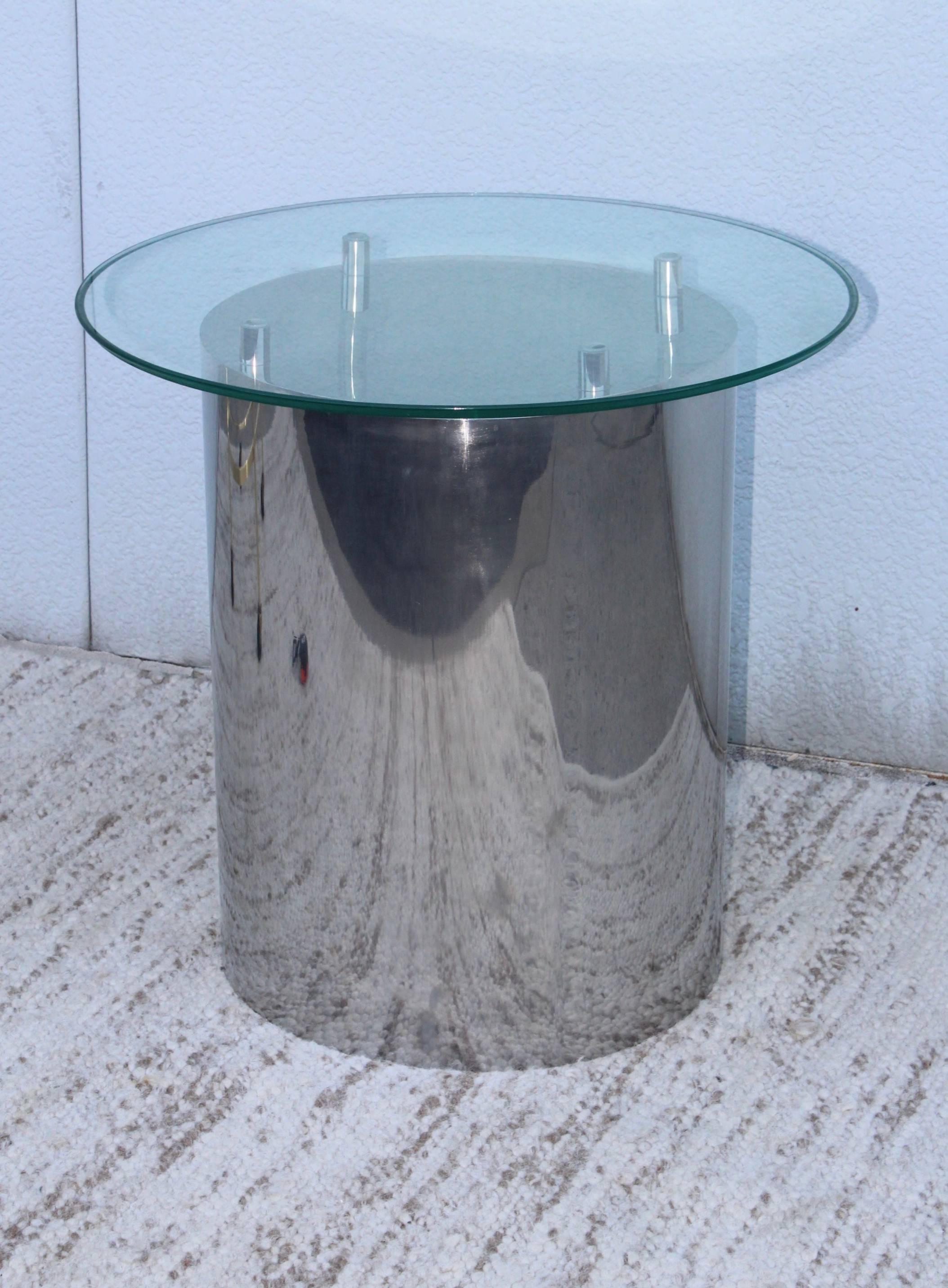 1970's solid polished steel side table with glass top.