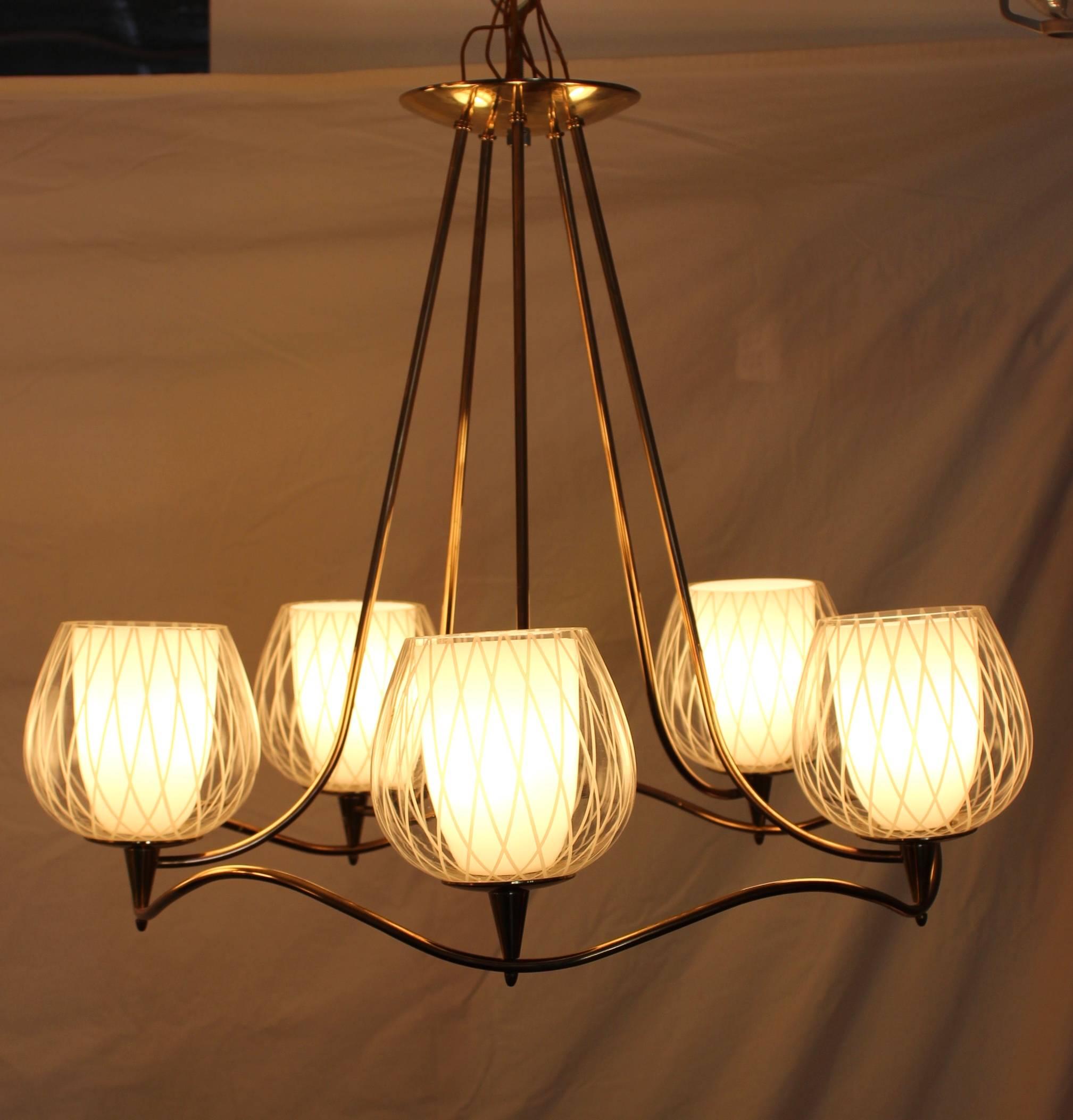 1950s Lightolier brass chandelier with original double case glass, the inner shade is milk glass the outer shade is etched glass.