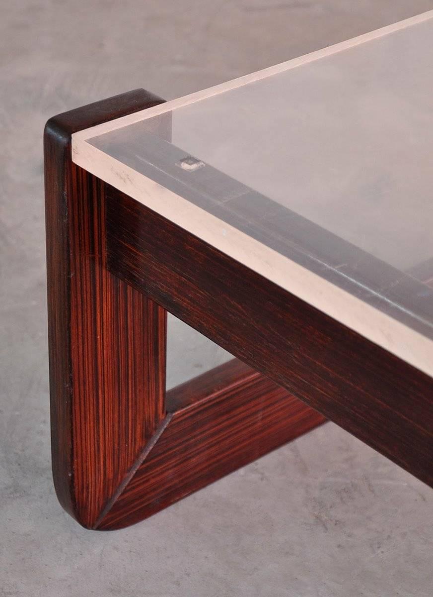 Noted Brazilian designer Percival Lafer created this stylish pair of occasional tables in solid rosewood. We have not seen them anywhere else with opaque Lucite tops. Signed.

(Note: We have a pair of these in a lighter stain with smoked glass tops.