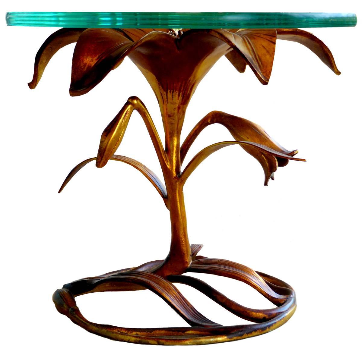Often attributed to Arthur Court, this Lily occasional table by Drexel is a lovely vision of aluminum dipped in gold.

Although this example has an attractive patina to the metal, we have another that is bright gold, presumably due to being