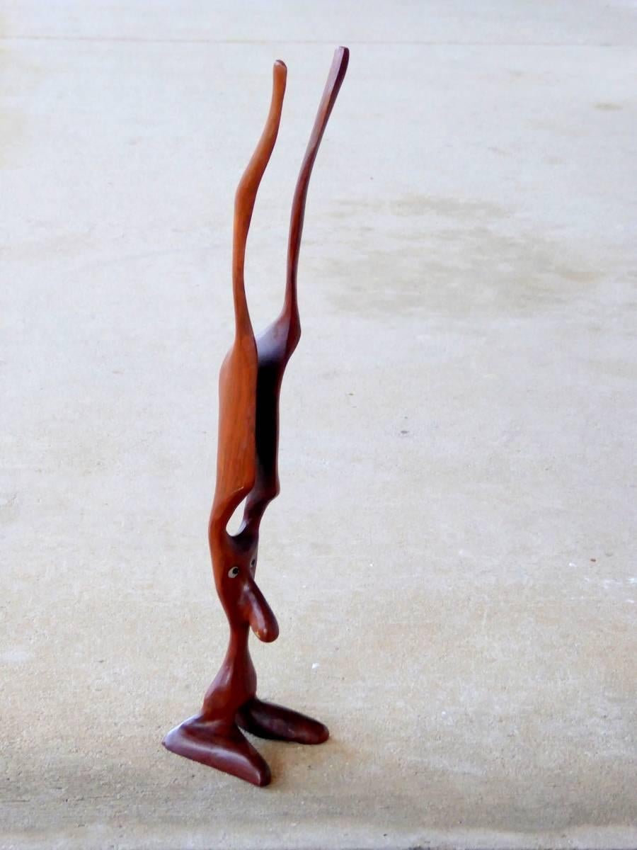 A whimsical rosewood creature sculpture made in Denmark by Knud Albert. Signed.

(Please note: We try to respond to messages within minutes, but in no event does it take more than a few hours. If you haven't received a reply to your inquiry, price