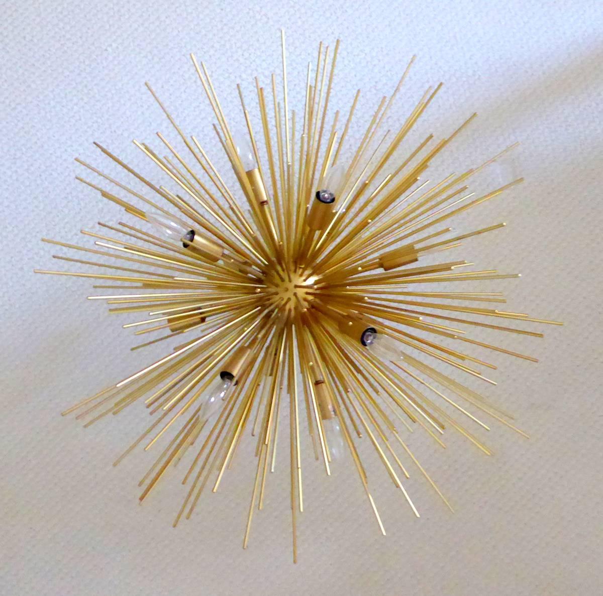 What a beauty! A gold-plated twelve-light chandelier in the Sputnik, urchin, or porcupine style. Absolutely stunning and ready to hang.

We can't be sure of the date. Although there are signs of age, the condition is too good to say 1950s -- the
