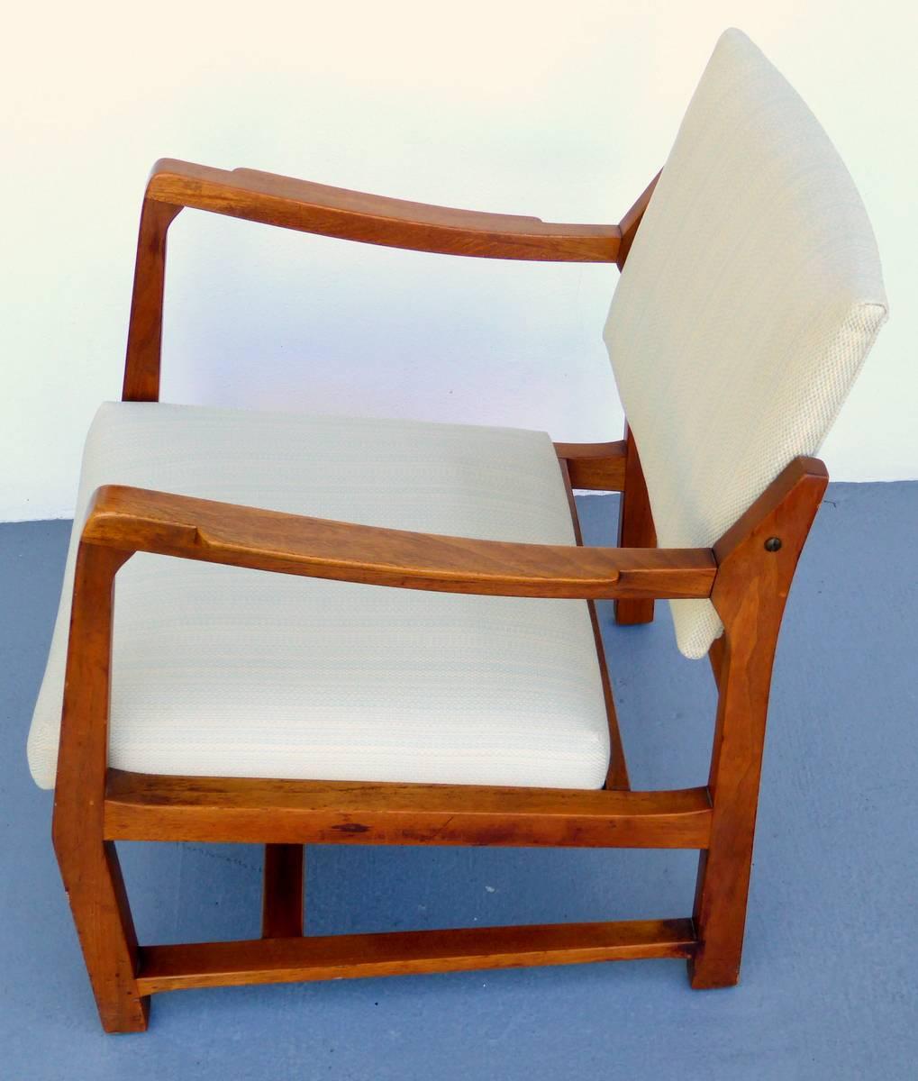 This solid walnut armchair by Edward Wormley for Dunbar is not only handsome but also comfortable, with a backrest that tilts. Nicely reupholstered in a subtle creamy pattern.

A few important notes about all items available through this 1stdibs